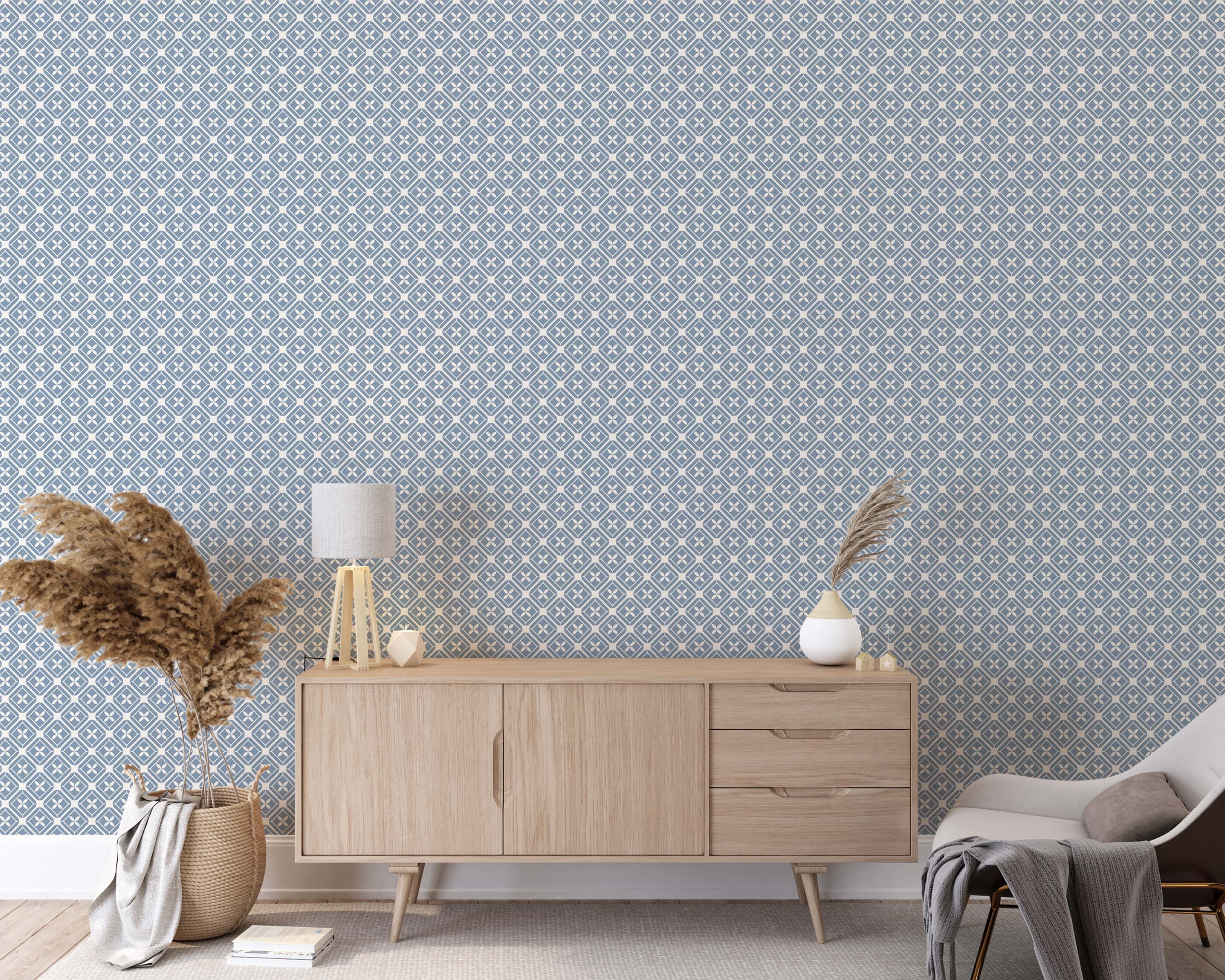 Wallpaper featuring an off-white geometric diamond lattice with central quatrefoil motifs, on a muted blue background.