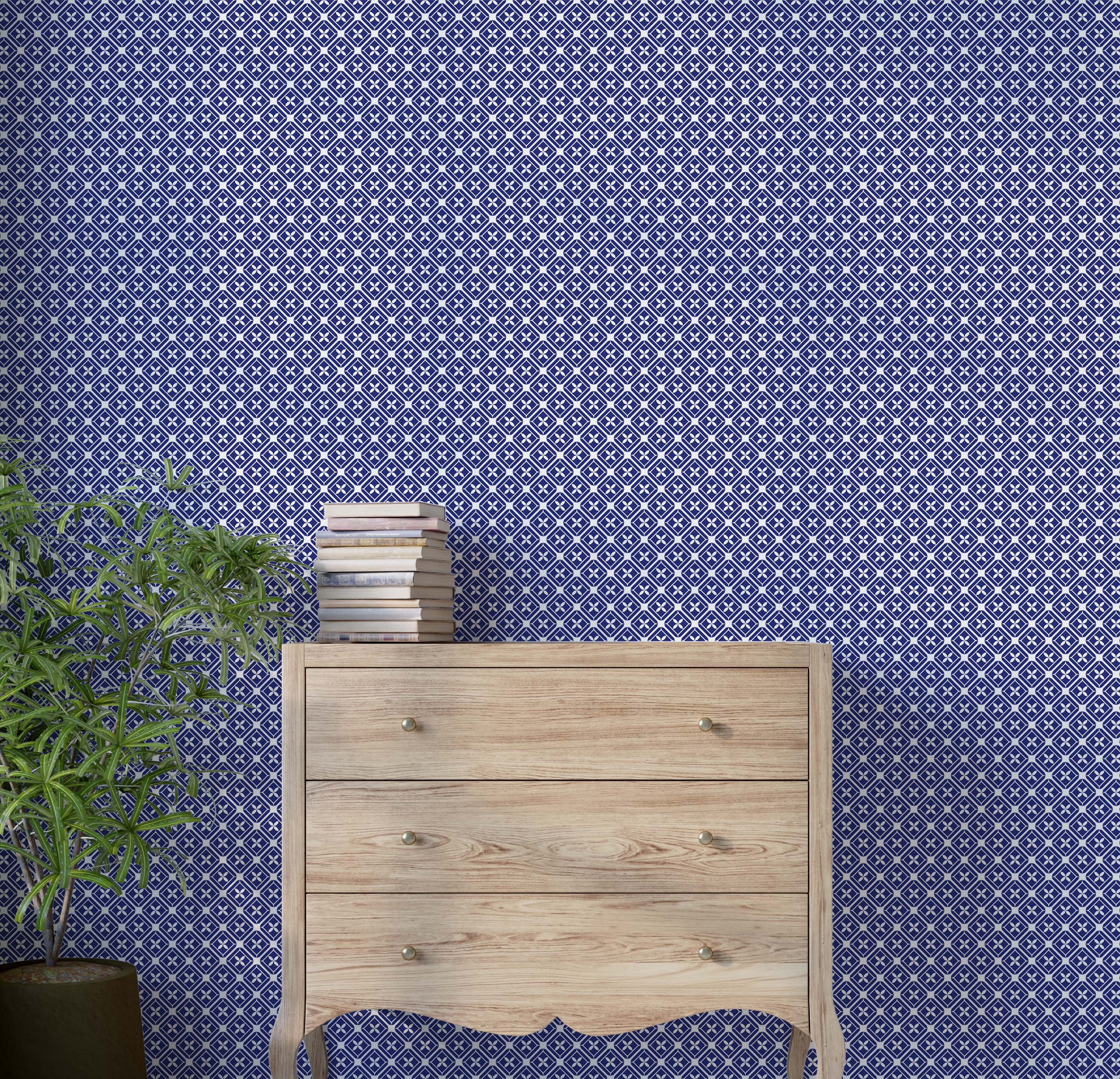 Geometric wallpaper with a repeating grid of white interlocking diamonds, each containing a stylized flower on a blue field.