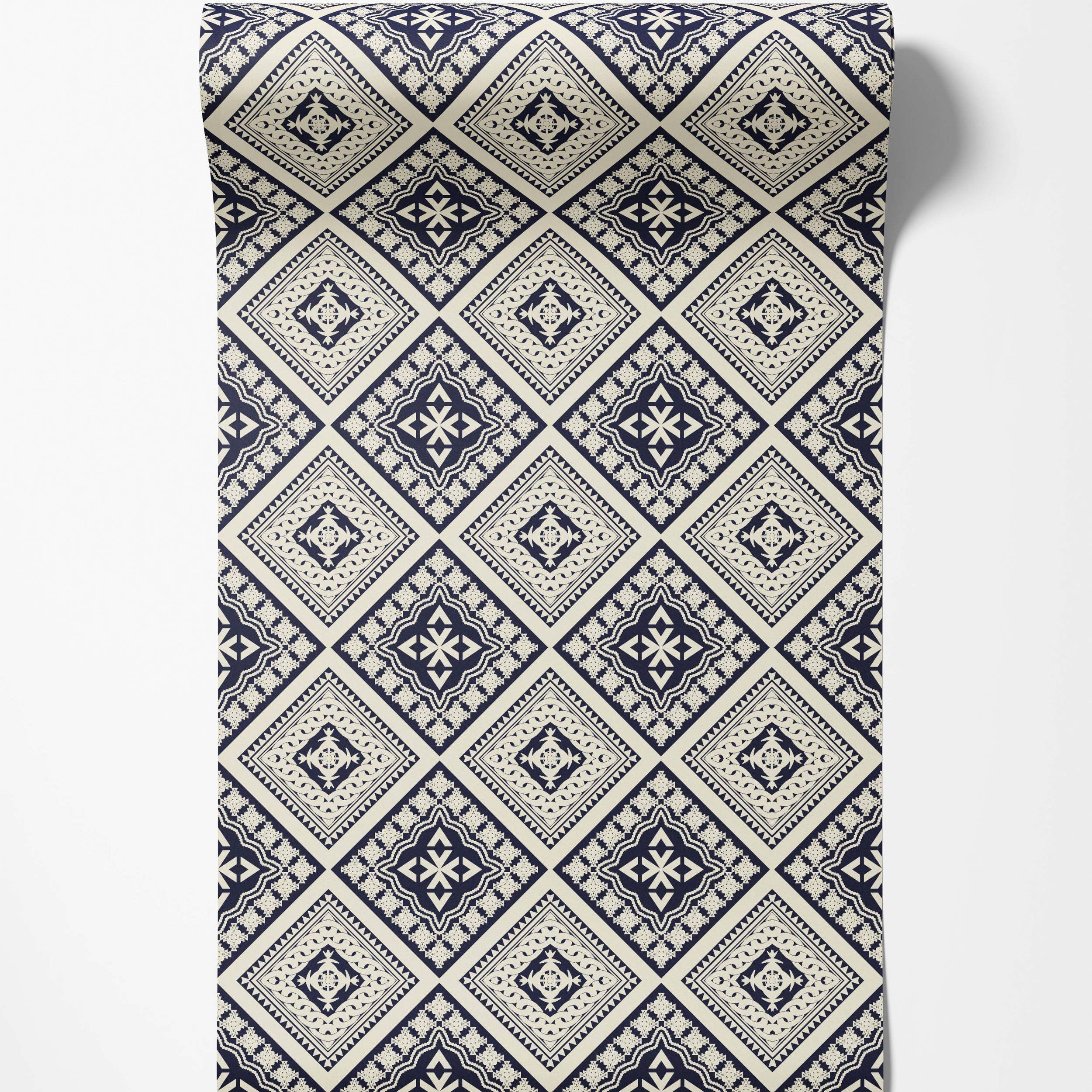 Geometric wallpaper with alternating intricate diamond motifs in navy blue and cream.