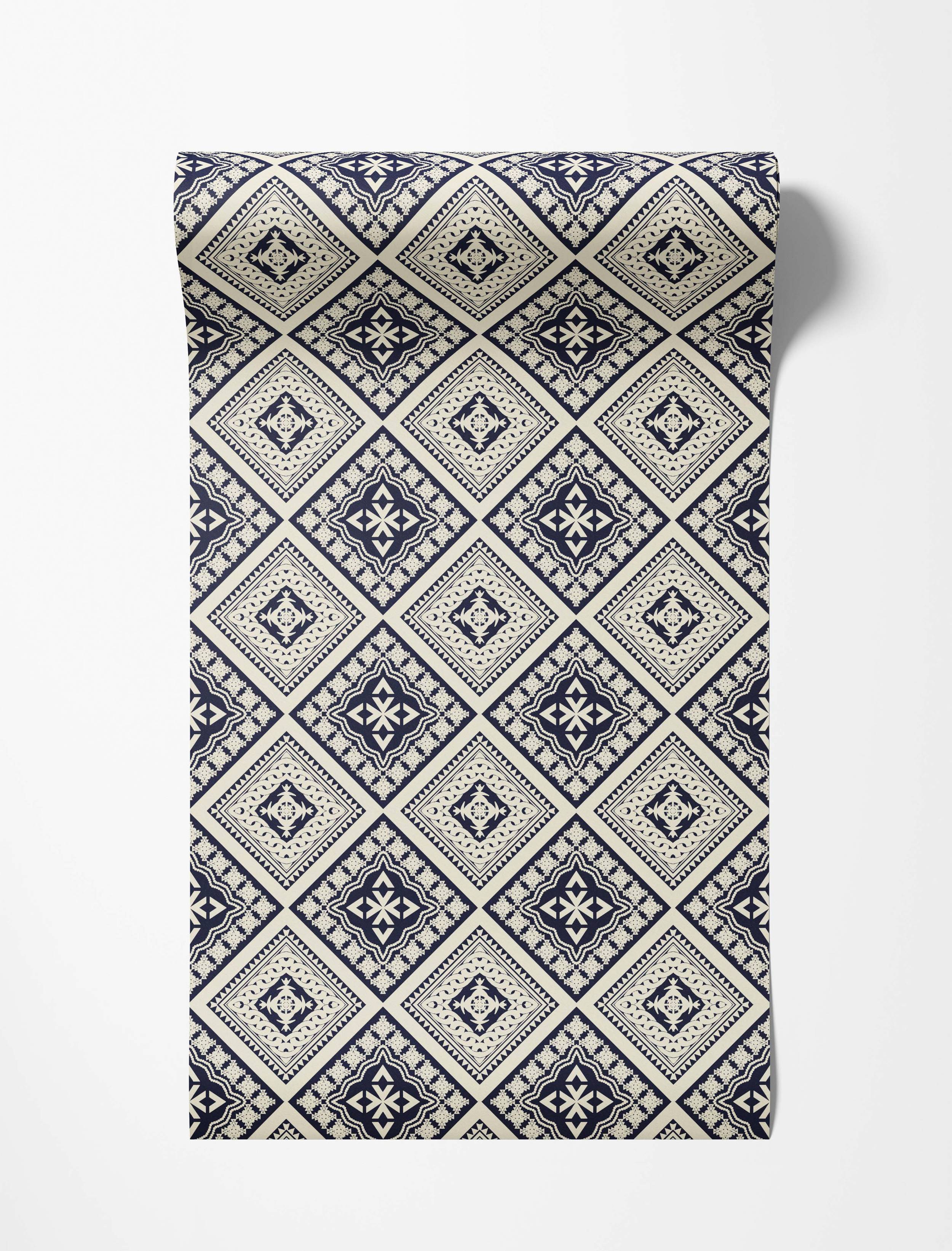 Geometric wallpaper with alternating intricate diamond motifs in navy blue and cream.