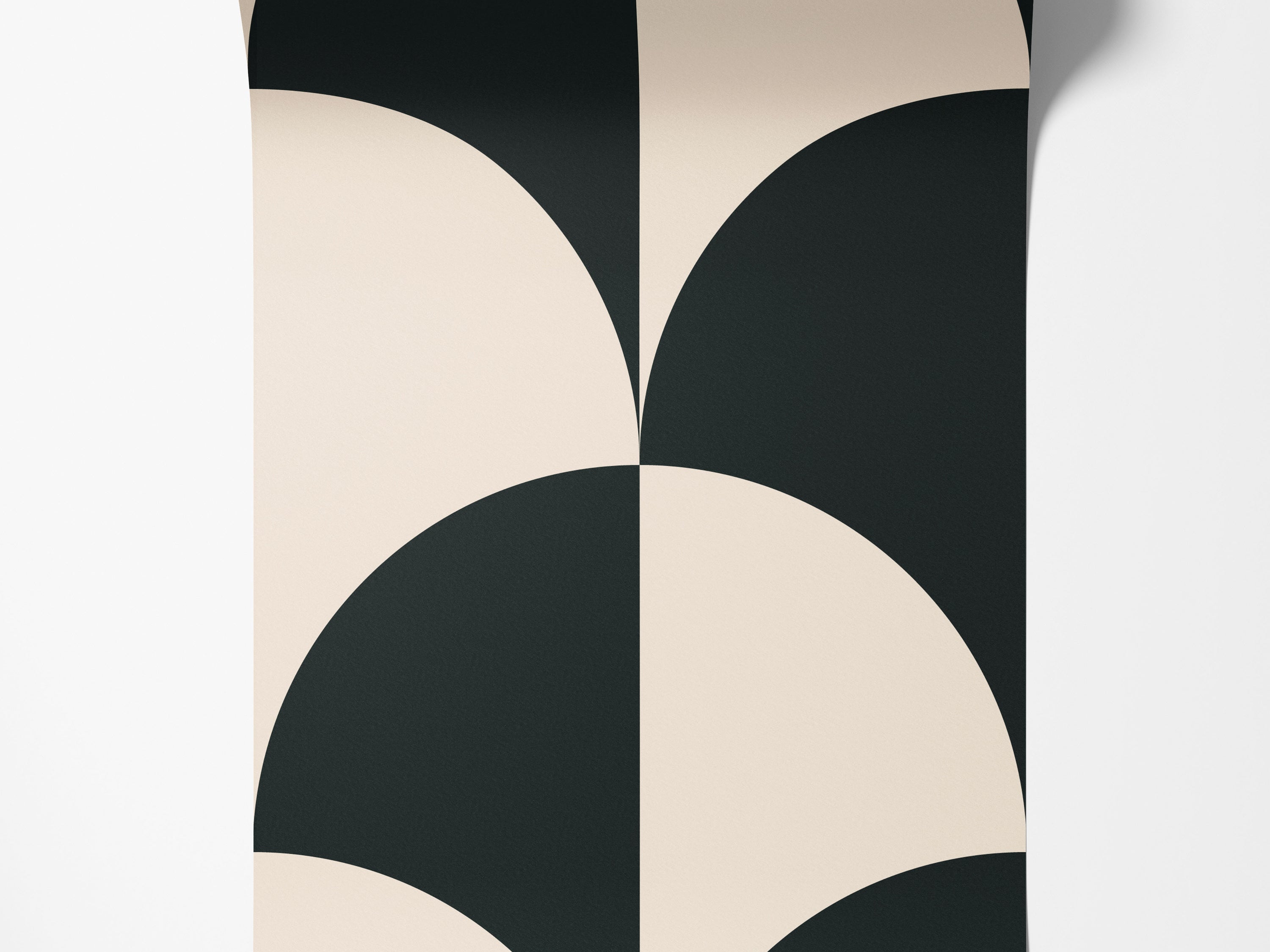 Geometric wallpaper featuring a bold, repeating pattern of interlocking black and beige quarter-circle fan shapes.