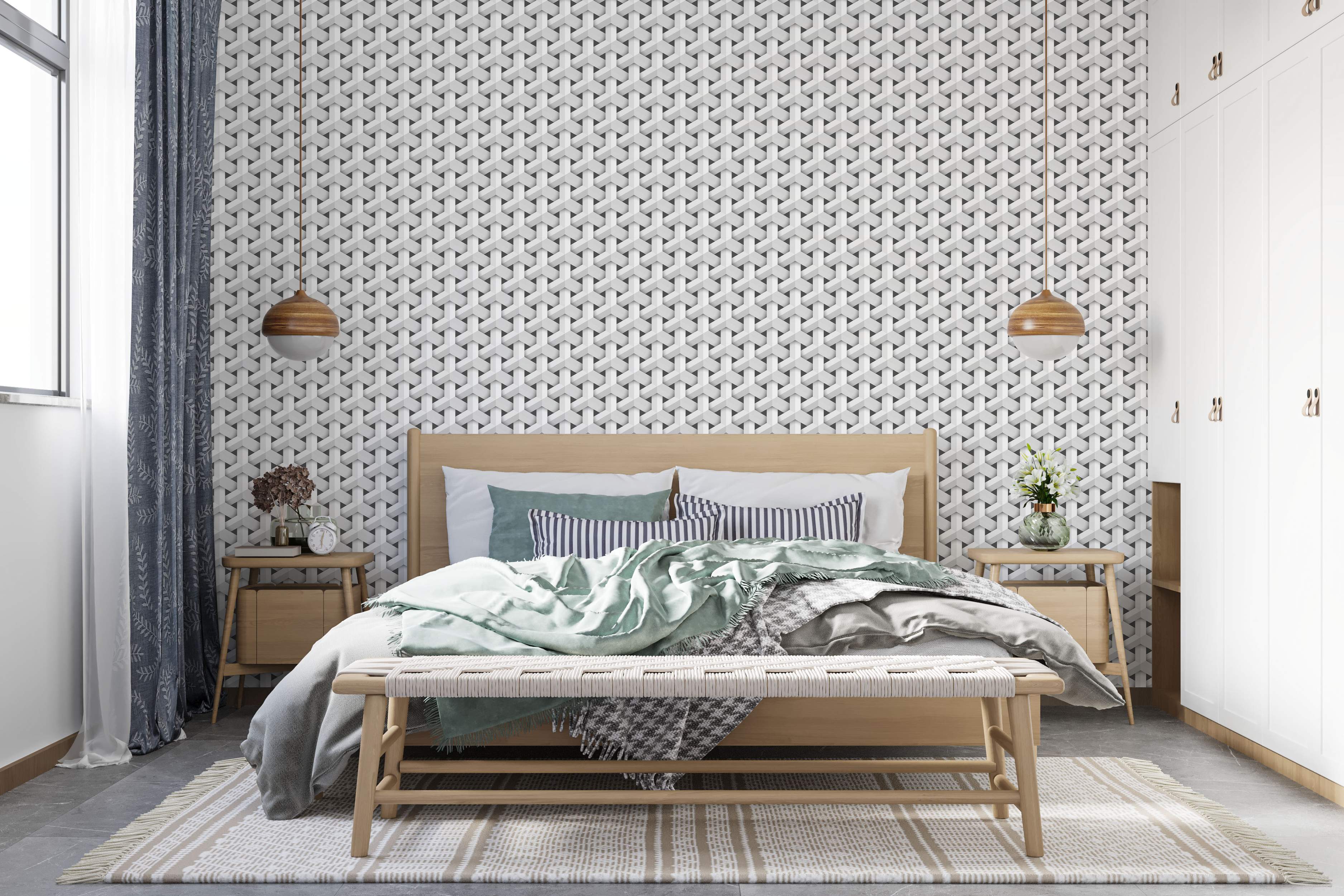 Geometric wallpaper with interlocking grey and white shapes forming a repeating 3D illusion pattern.