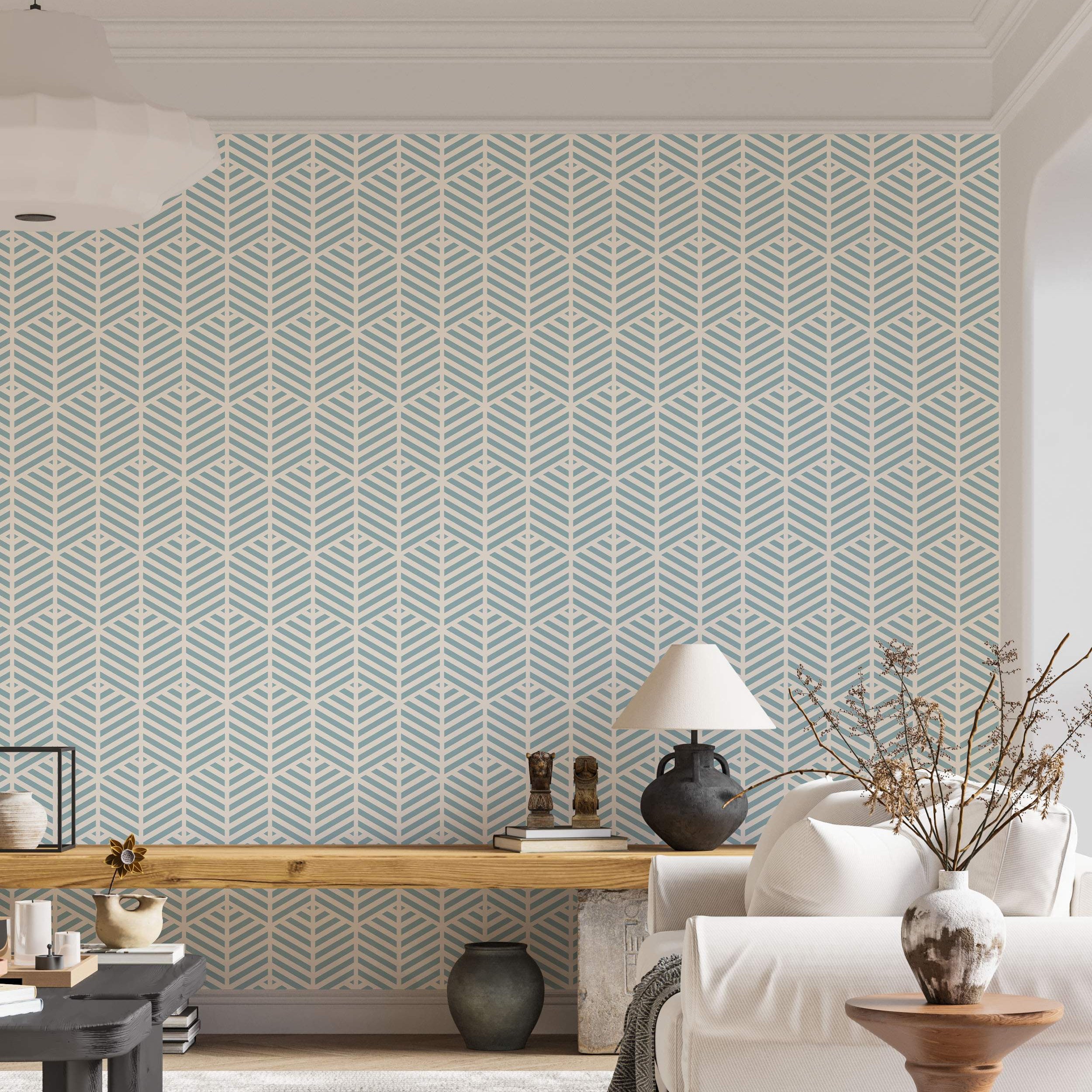 Geometric wallpaper with a repeating pattern of stylized light blue leaf-like chevron shapes on a cream background.