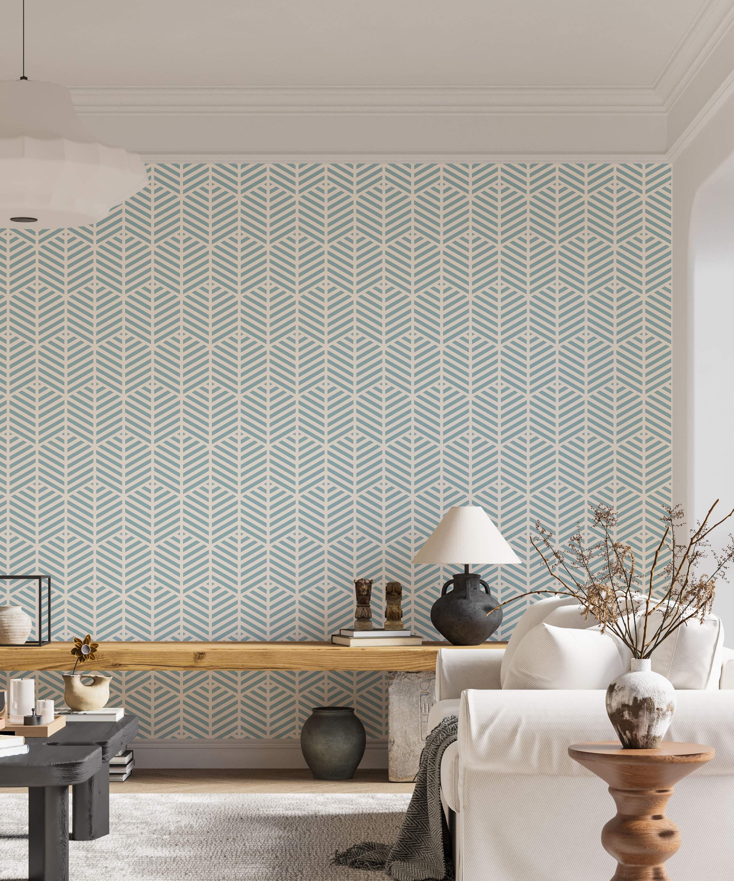 Geometric wallpaper with a repeating pattern of stylized light blue leaf-like chevron shapes on a cream background.