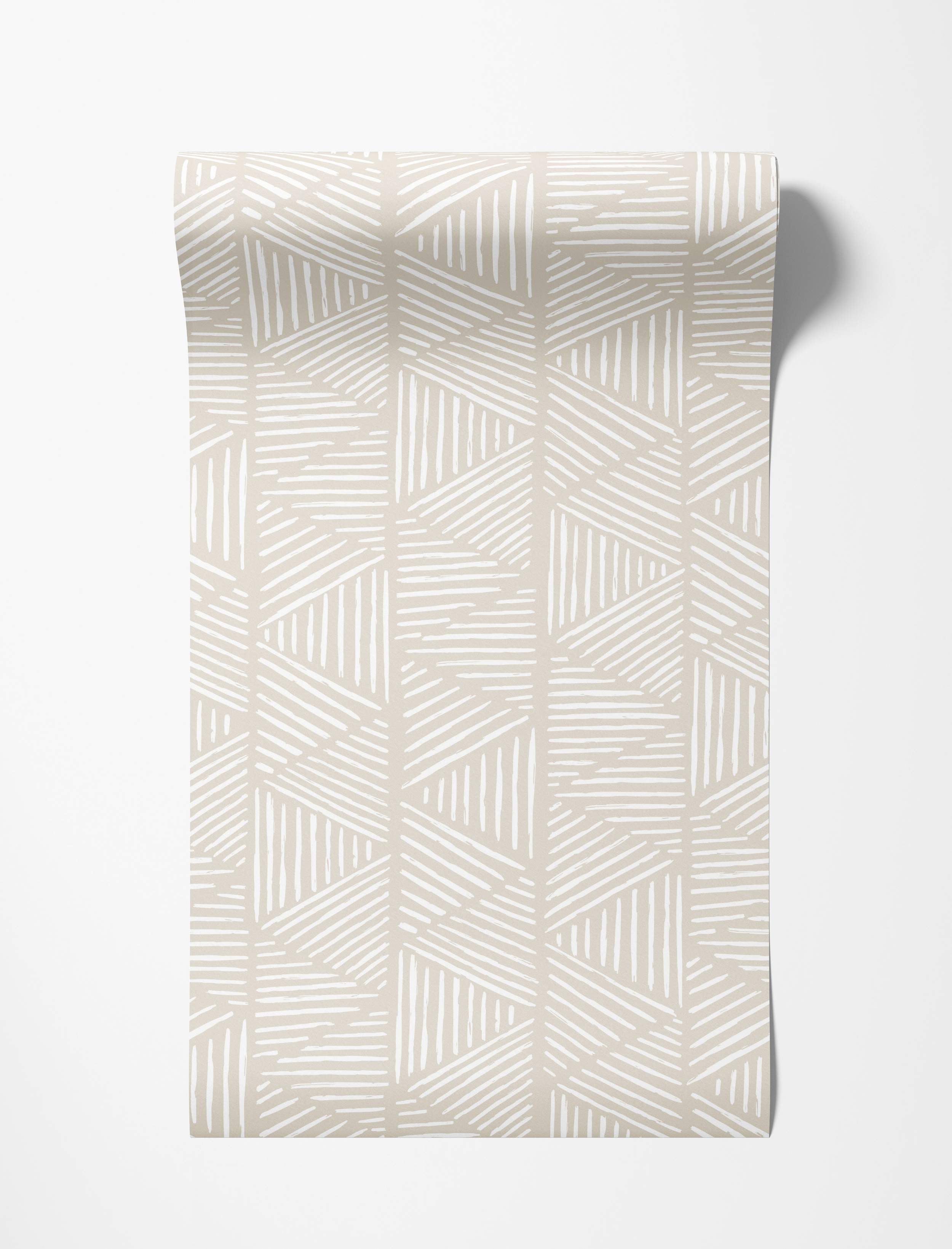 Beige wallpaper featuring a geometric pattern of white sketched lines forming interlocking shapes.