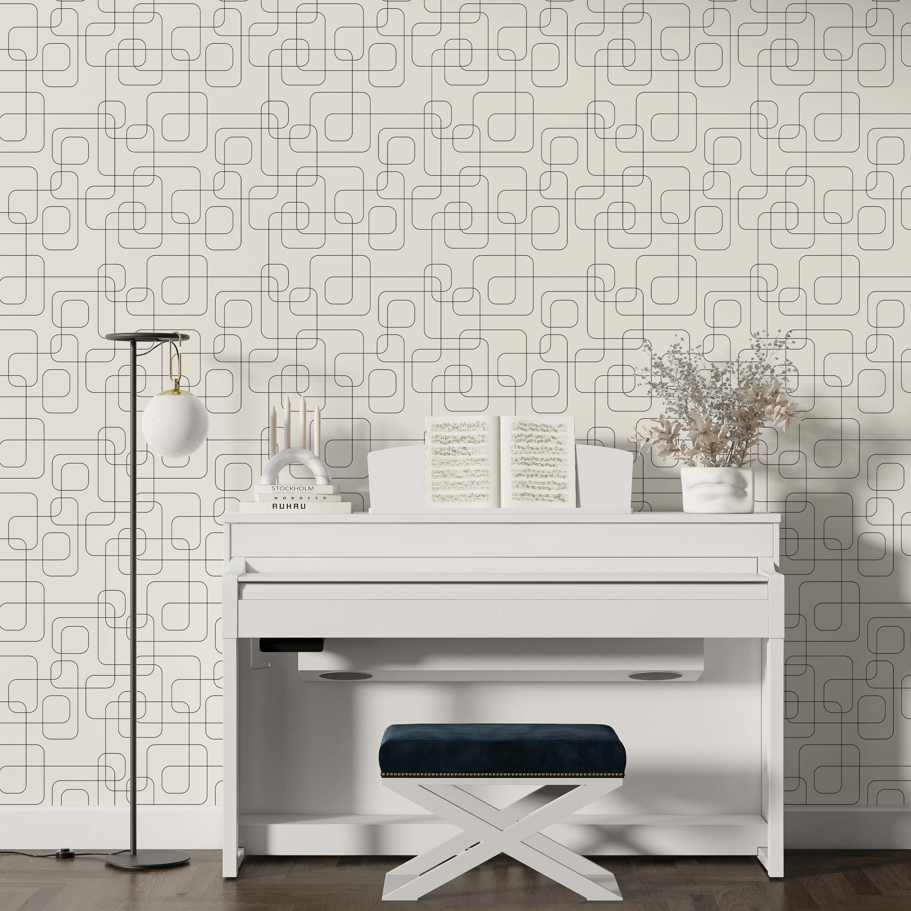 Geometric wallpaper featuring thin black interconnected lines forming rounded square shapes on a light beige background.