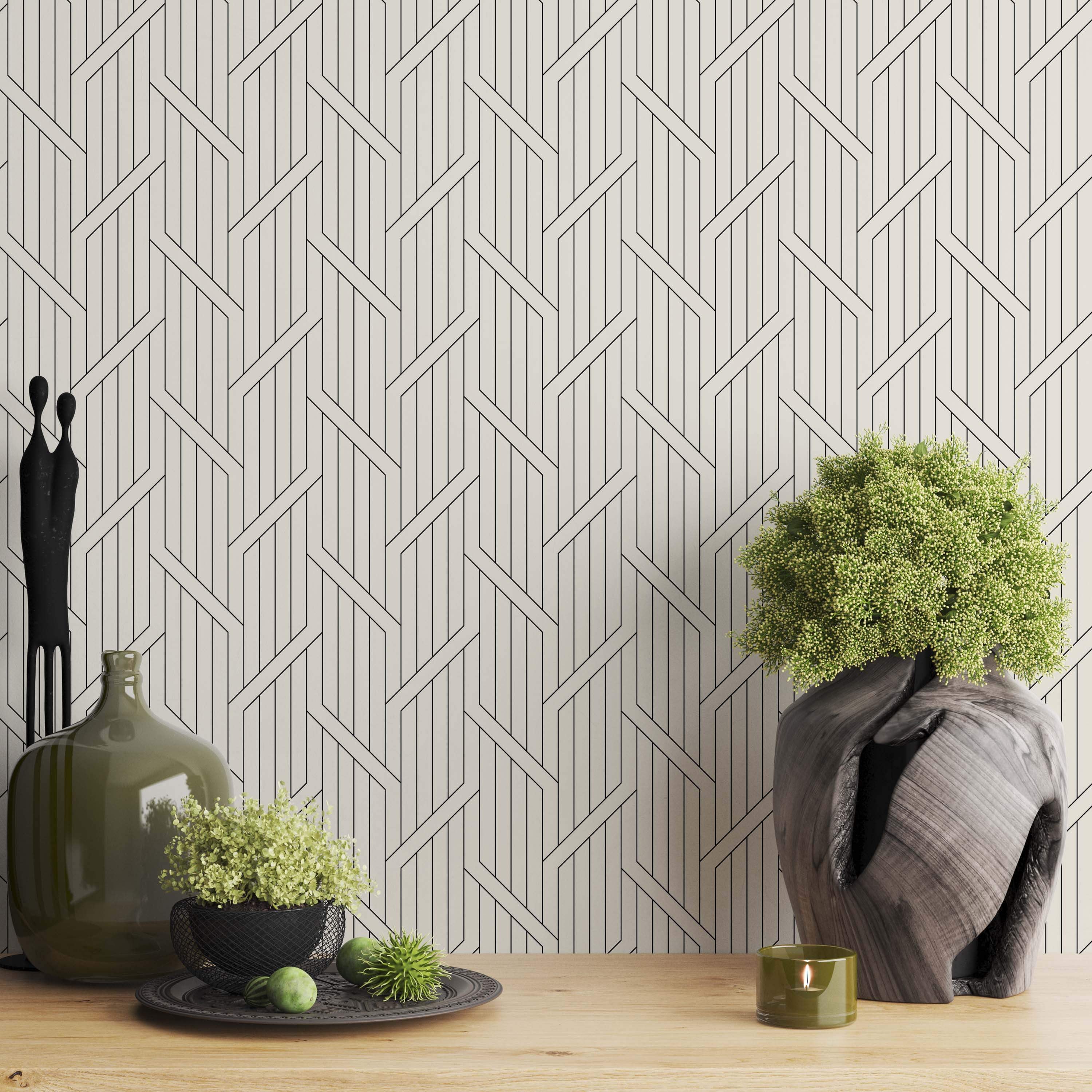 Geometric wallpaper with thin black intersecting vertical and diagonal lines forming a complex pattern on an off-white background.