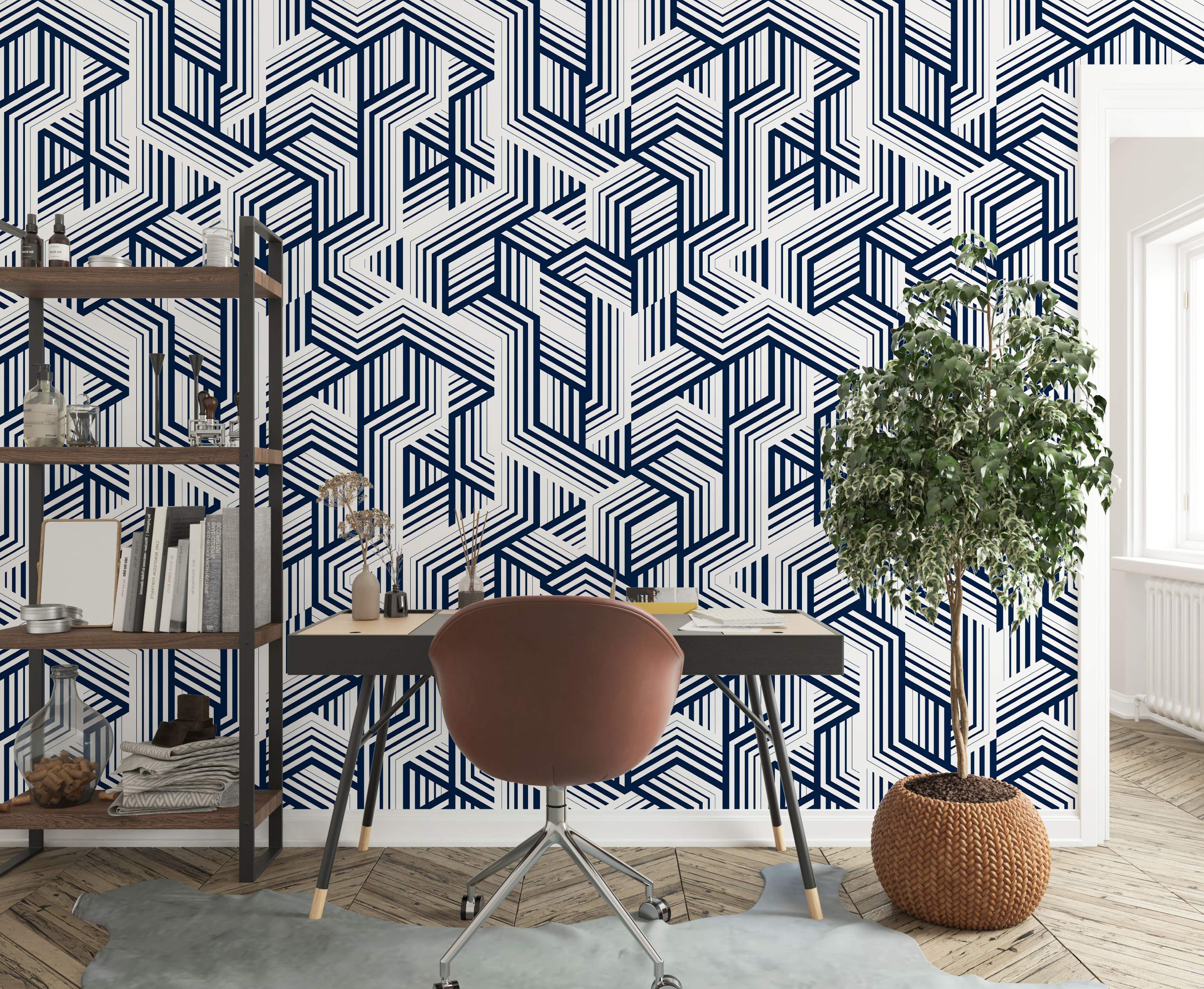 Geometric wallpaper featuring bold navy blue interlocking lines forming complex angular shapes on a white background.