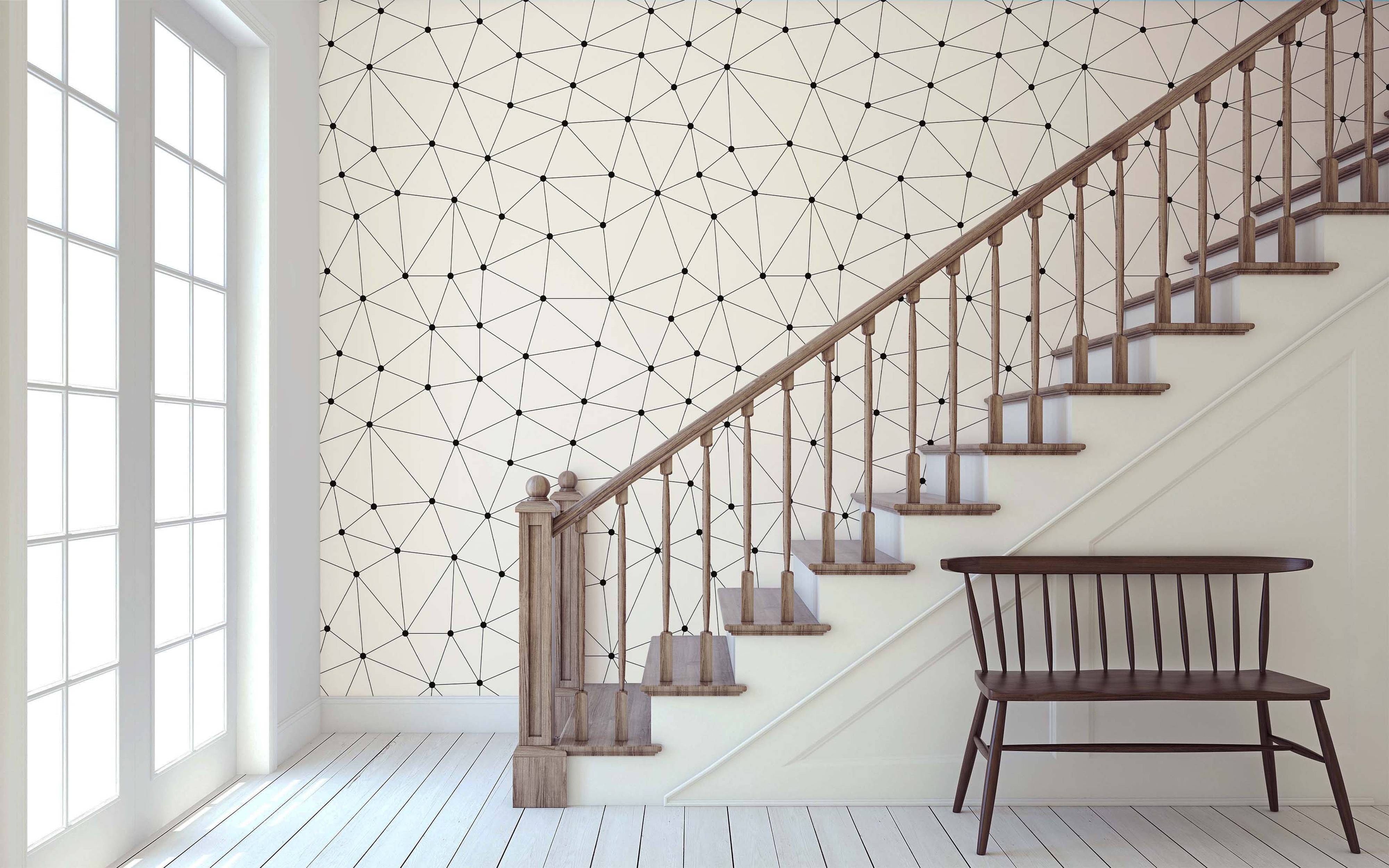 Geometric wallpaper featuring a network of thin black lines connecting black dots, forming triangles on a cream background.