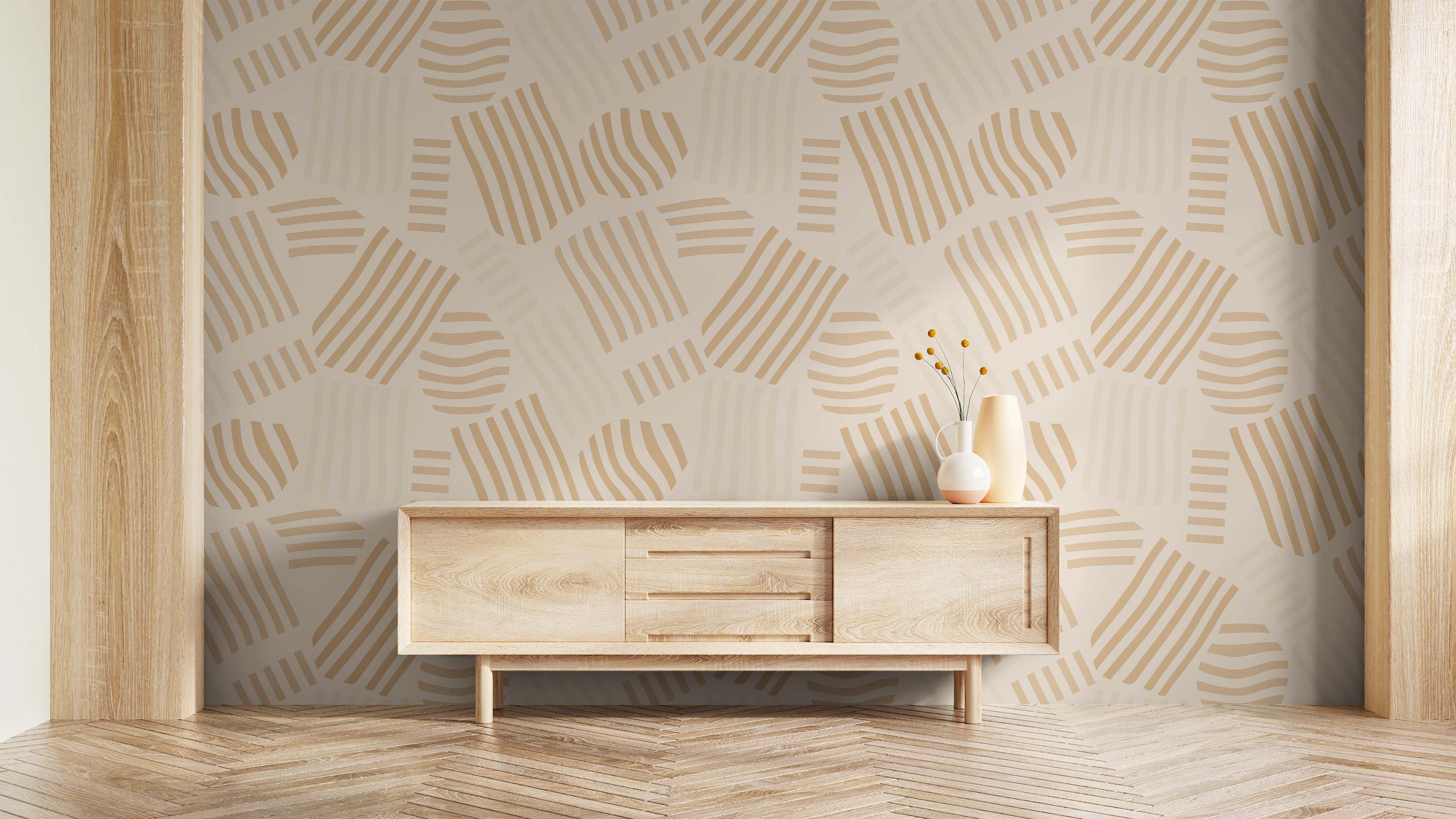 Wallpaper with a pattern of geometric oval and block shapes, each detailed with tan stripes, on a light beige background.