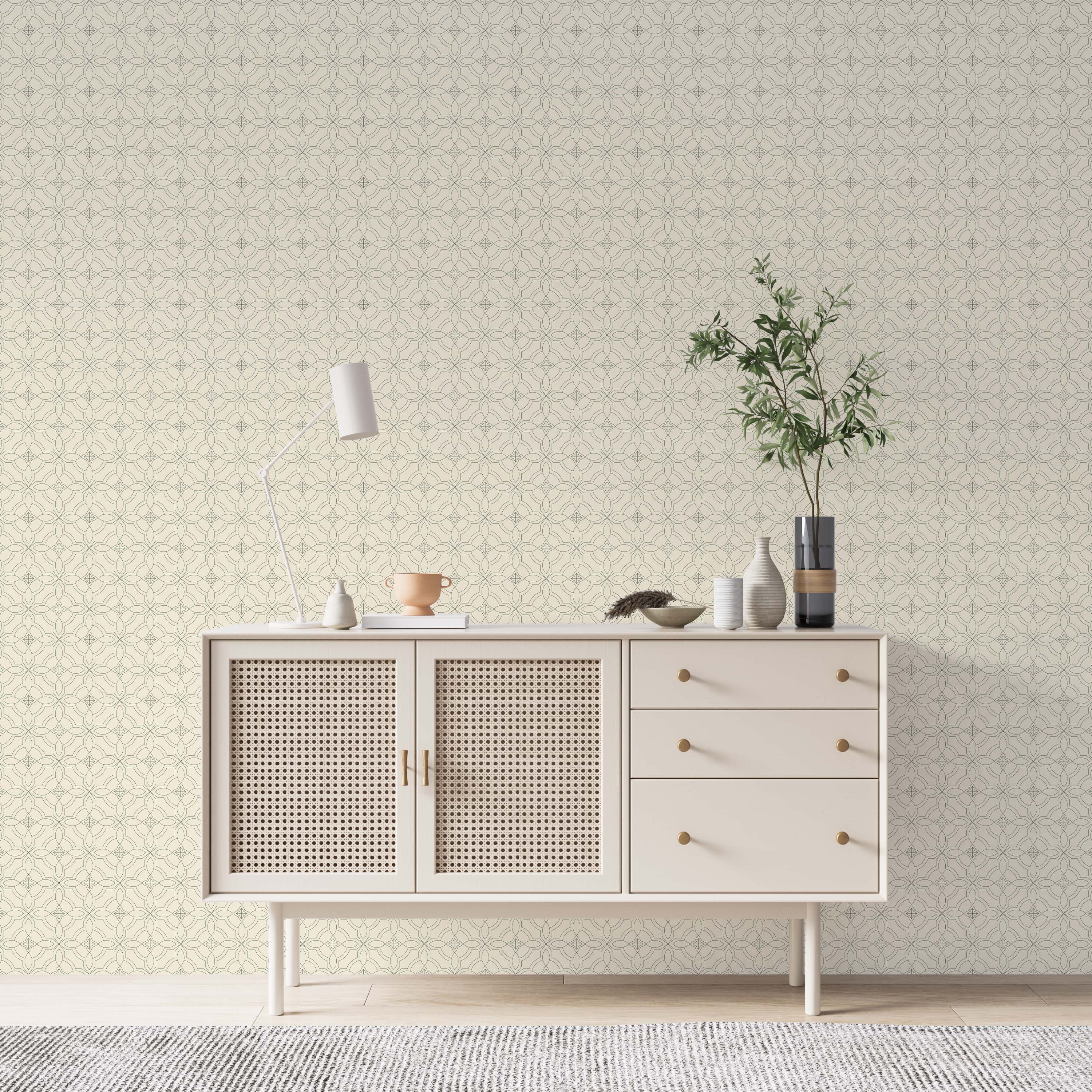 Geometric wallpaper with a delicate, dark gray line pattern of interlocking ovals and stars on a soft cream background.
