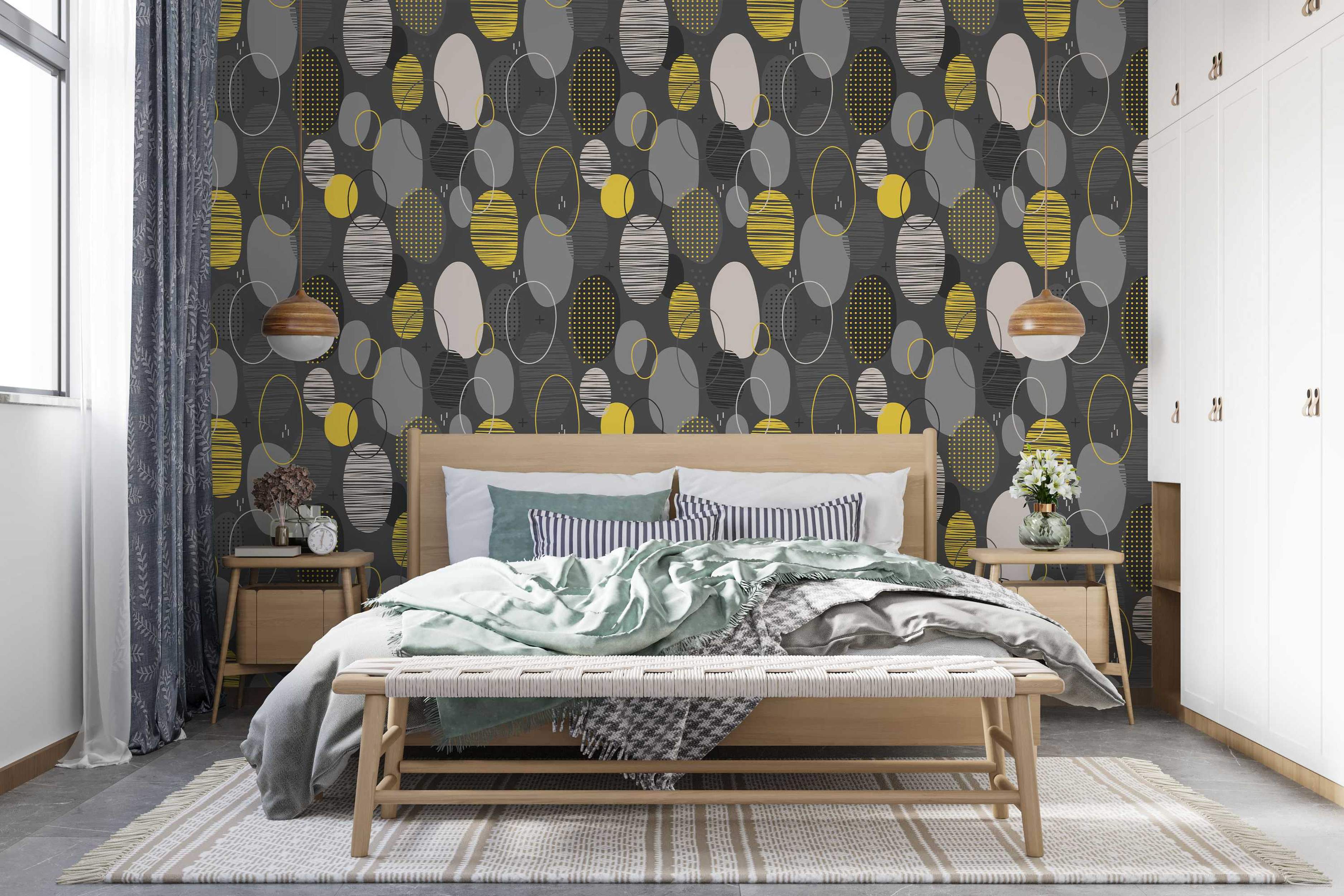 Repeating wallpaper pattern of mid-century style ovals in gray, yellow, and beige with varied textures on a charcoal base.