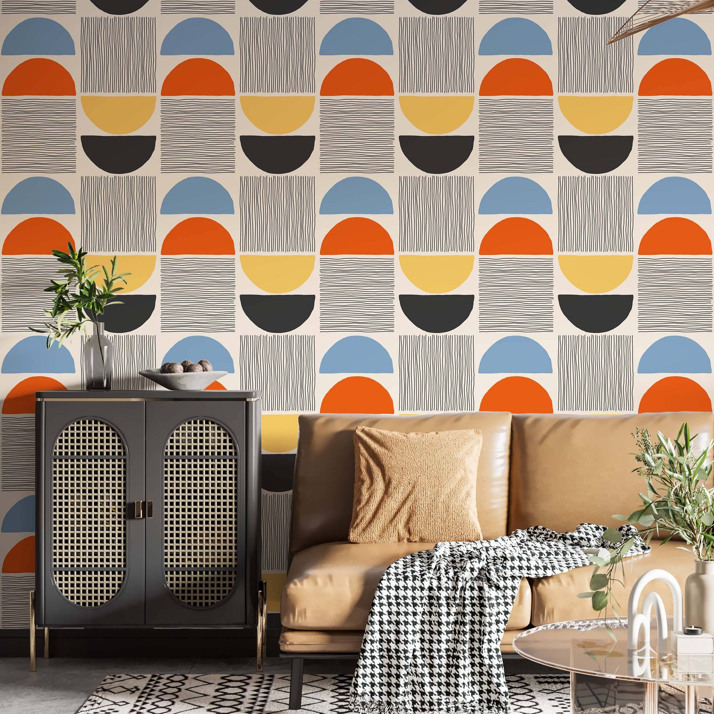 Geometric wallpaper with stacked semi-circles in blue, orange, yellow, black, and coordinating line patterns on a beige background.