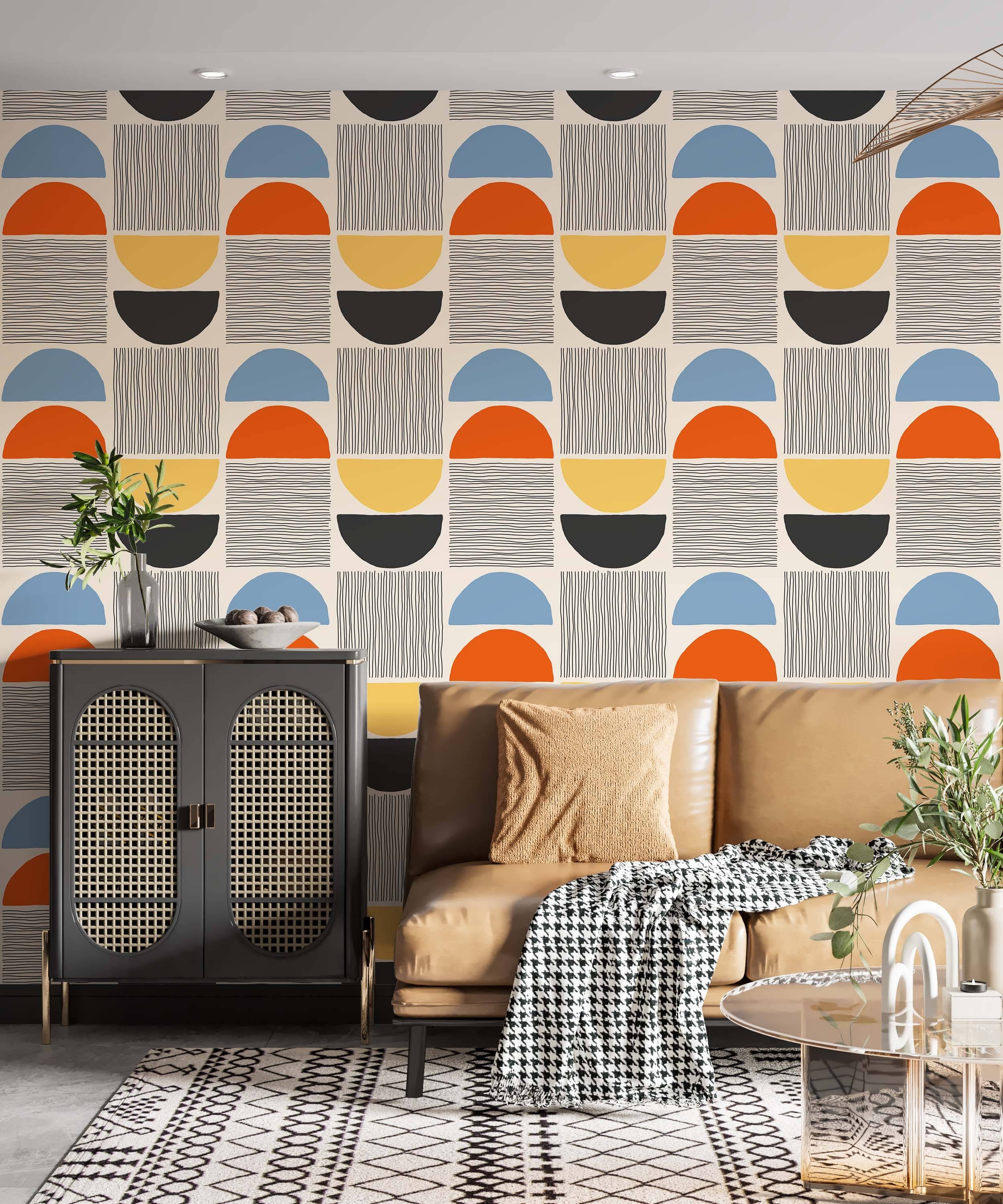 Geometric wallpaper with stacked semi-circles in blue, orange, yellow, black, and coordinating line patterns on a beige background.