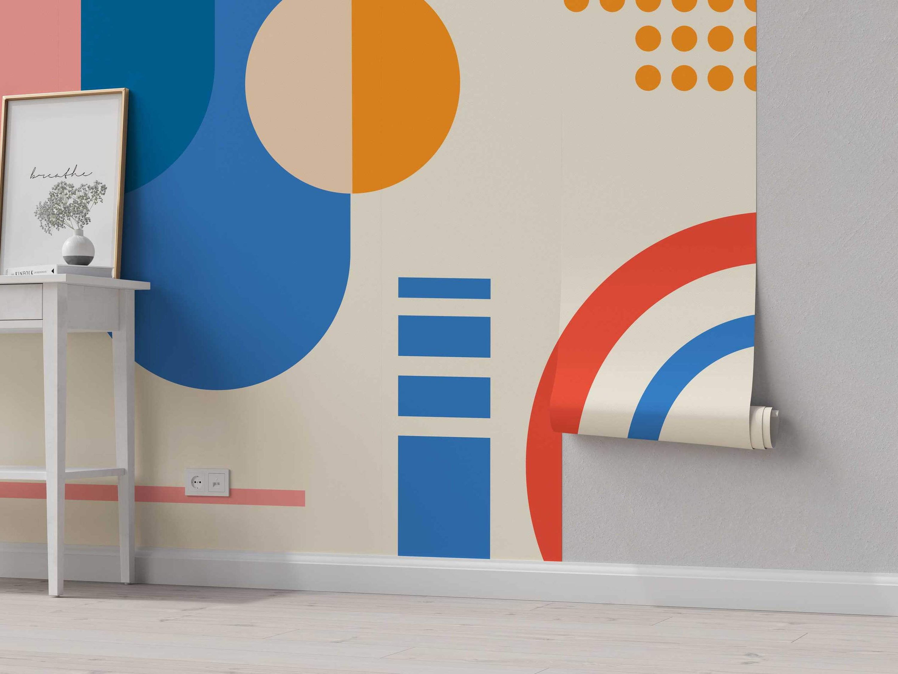 Abstract geometric mural featuring large blue, orange, and pink circles, rectangles, and arcs on a beige background.