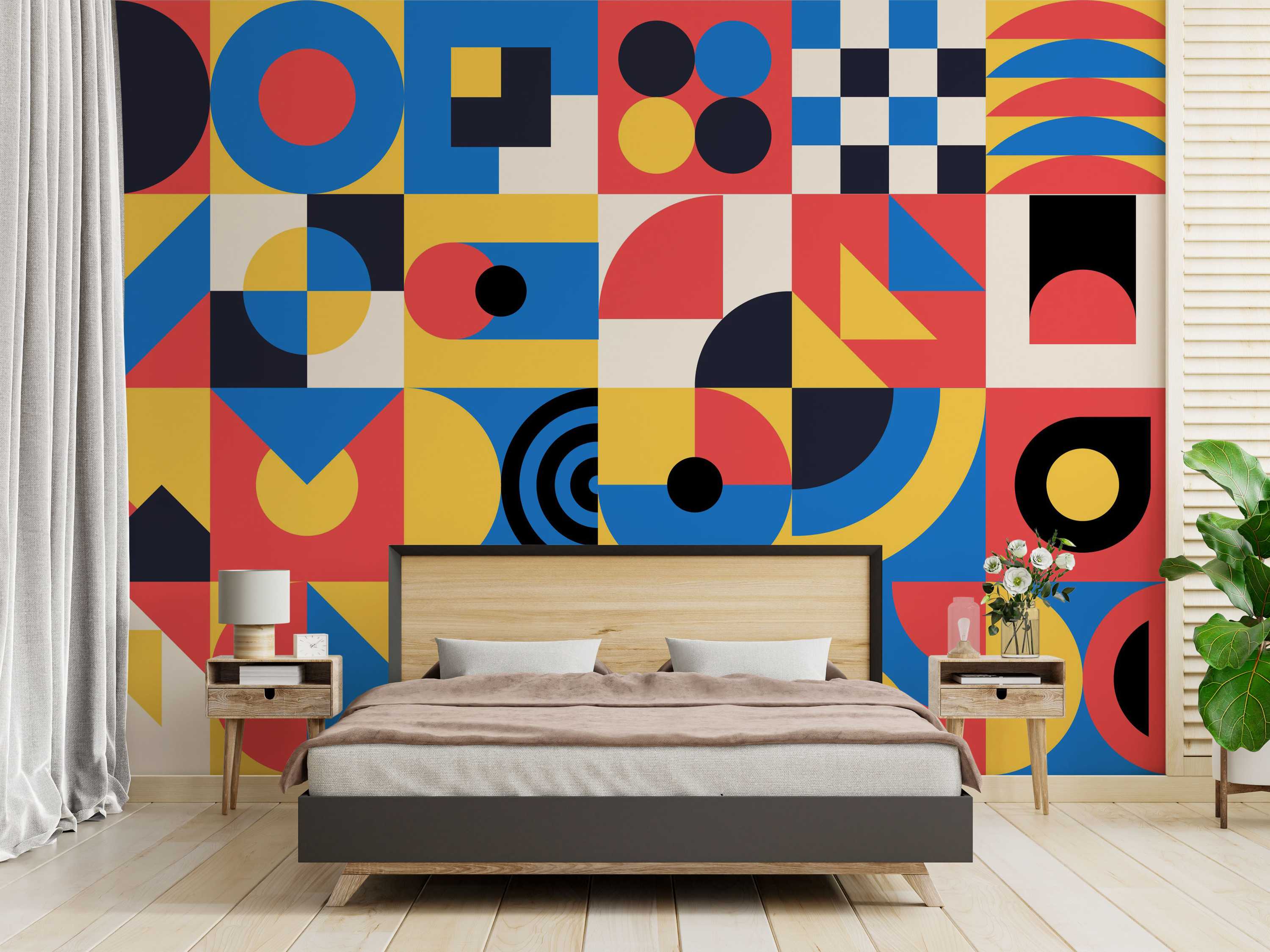 Bold geometric wallpaper featuring a grid of squares with circles, semicircles, and triangles in blue, red, yellow, black, and beige.