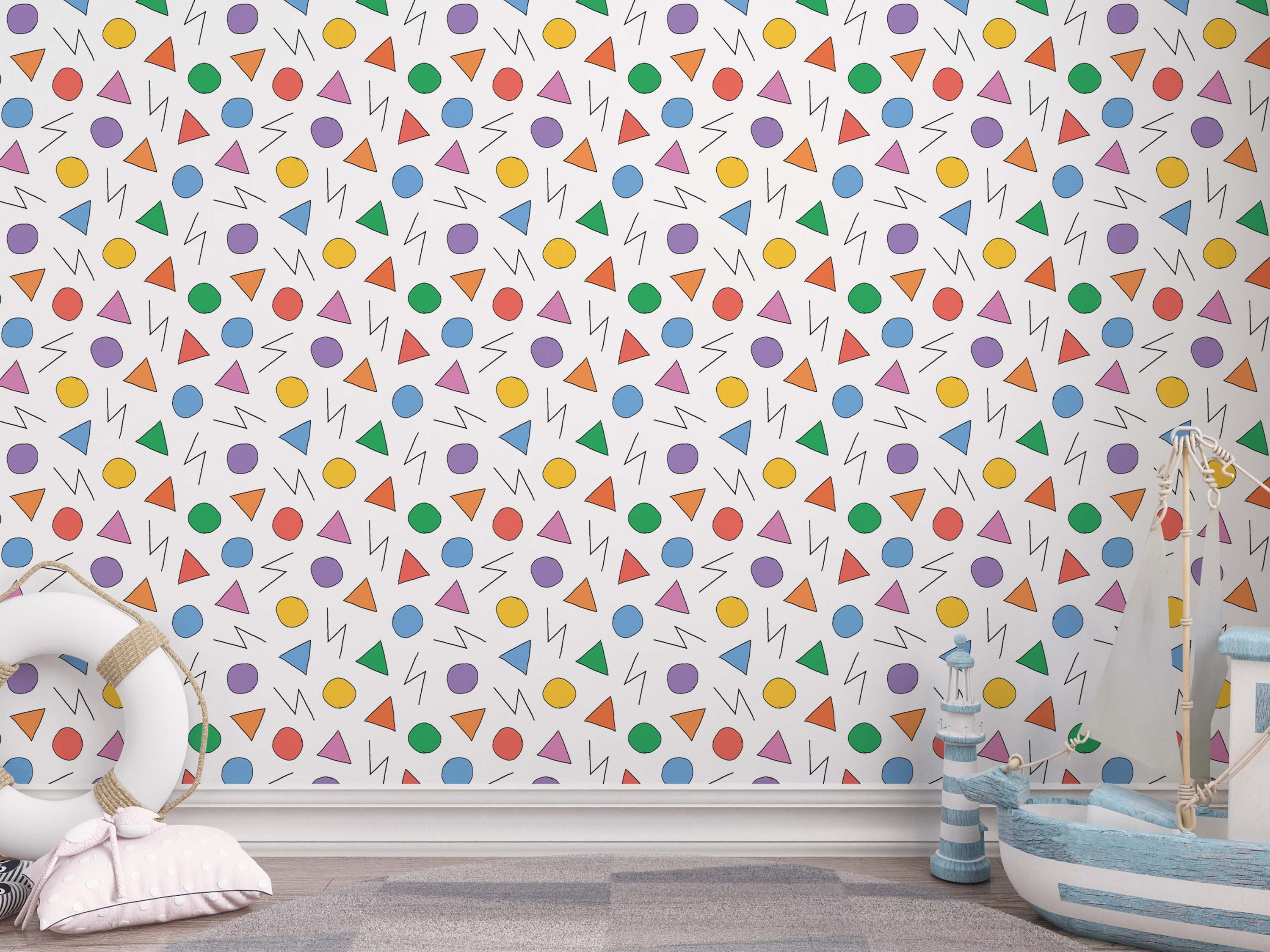 Playful wallpaper with hand-drawn colorful circles, triangles, and zig-zag lines on a white background.