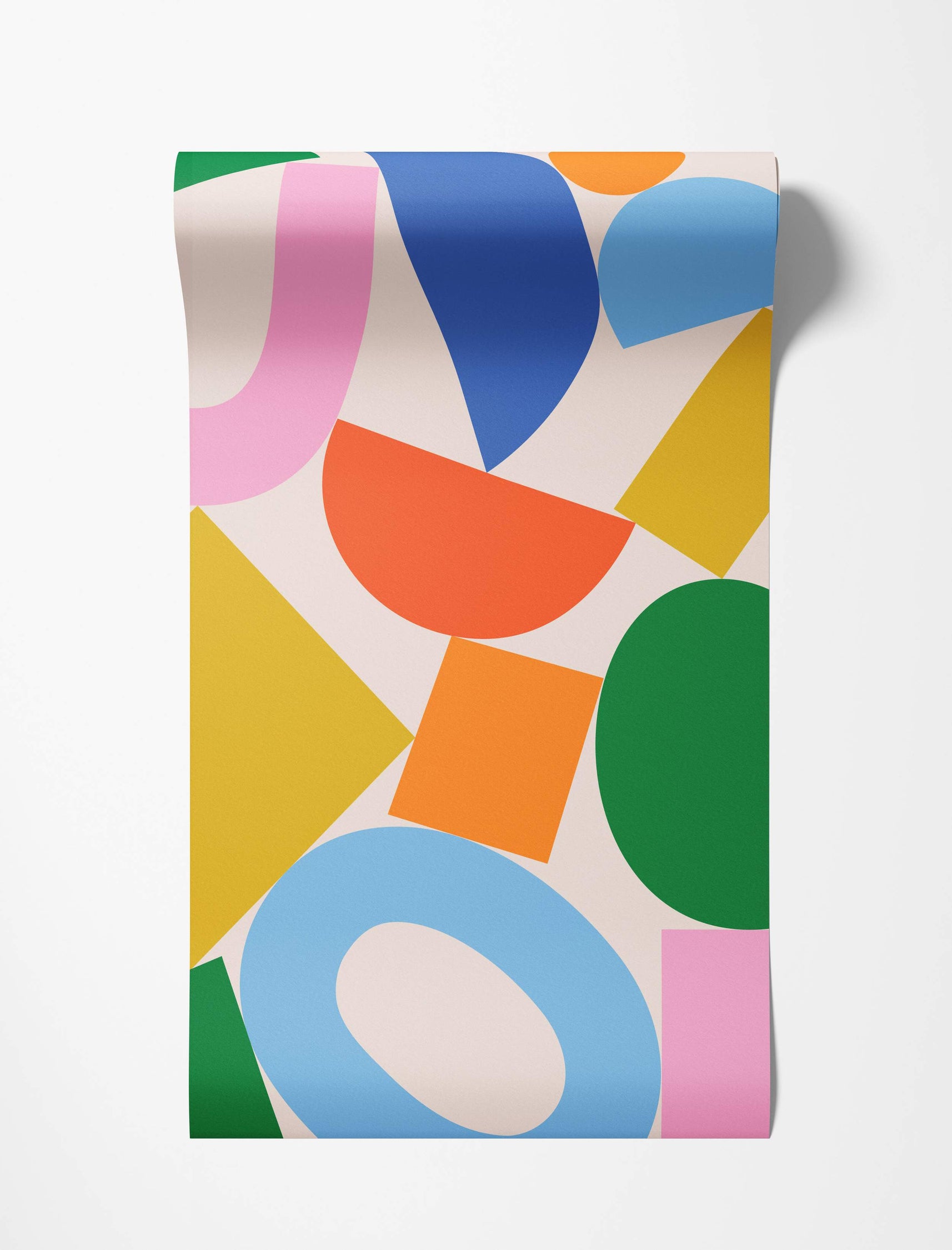 Wallpaper featuring an abstract pattern of overlapping geometric shapes in bold pink, blue, orange, yellow, and green on cream.