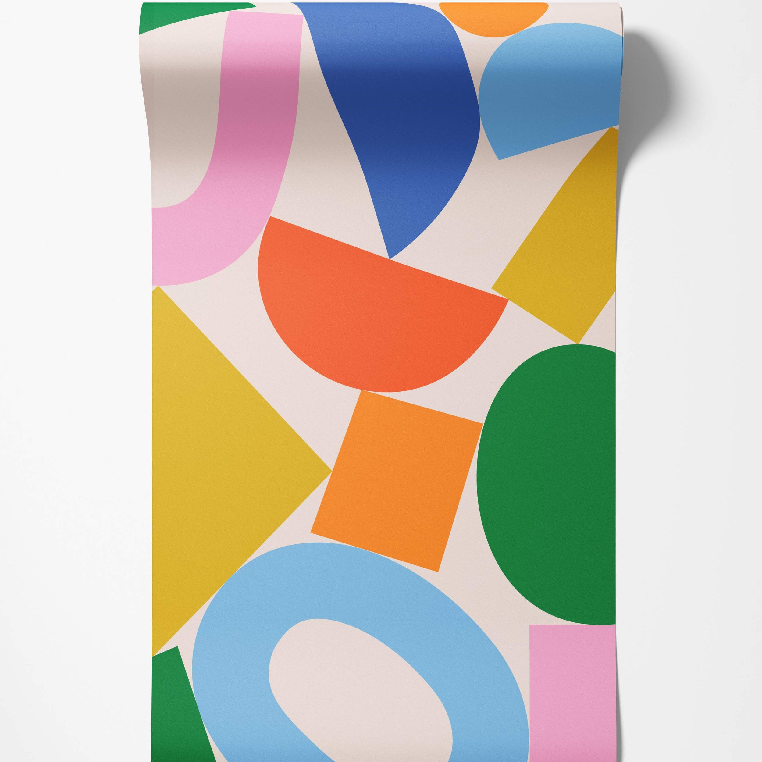 Wallpaper featuring an abstract pattern of overlapping geometric shapes in bold pink, blue, orange, yellow, and green on cream.