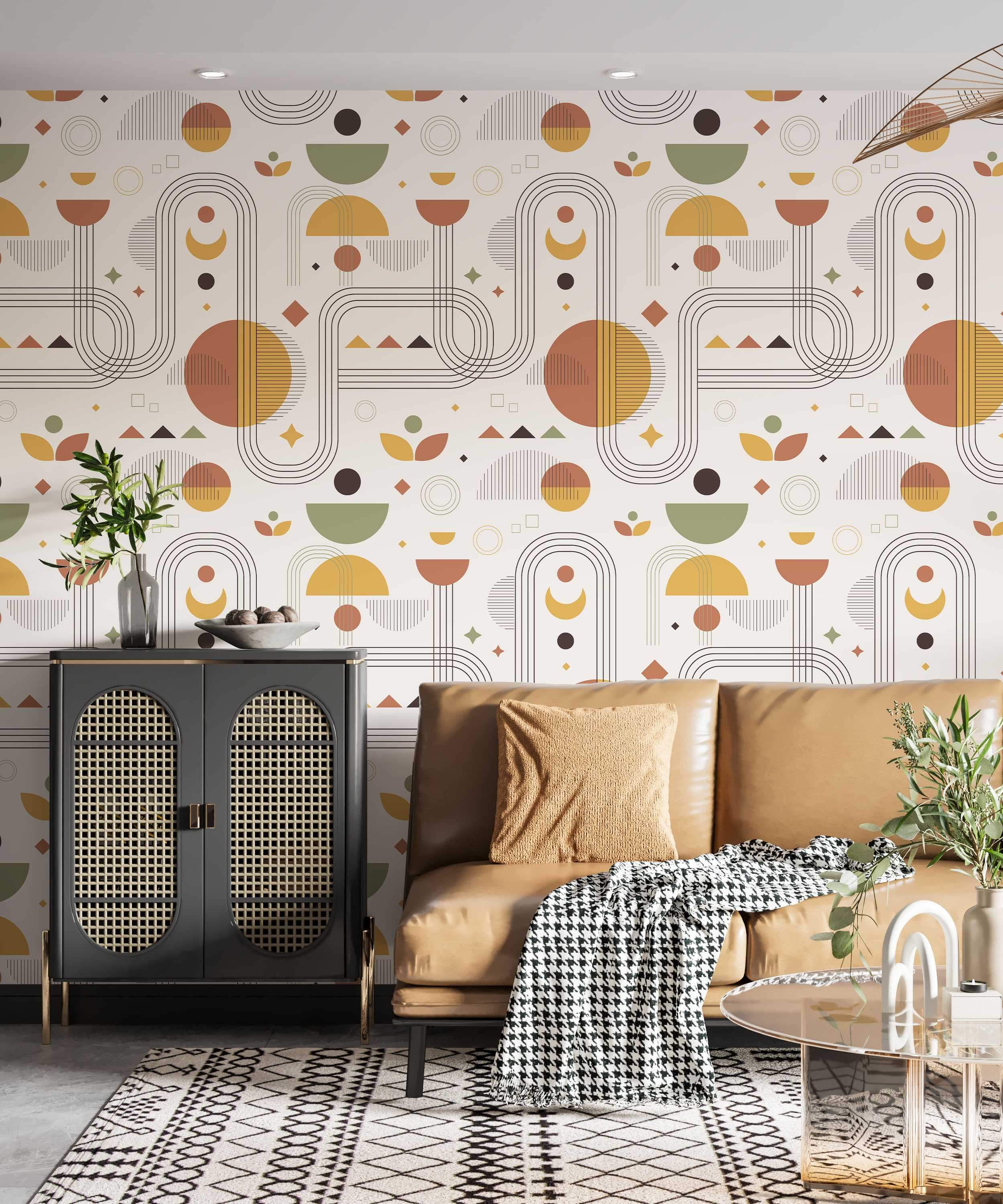 Repeating wallpaper pattern of geometric shapes like arches, semi-circles, and lines in earthy rust, yellow, and green tones.