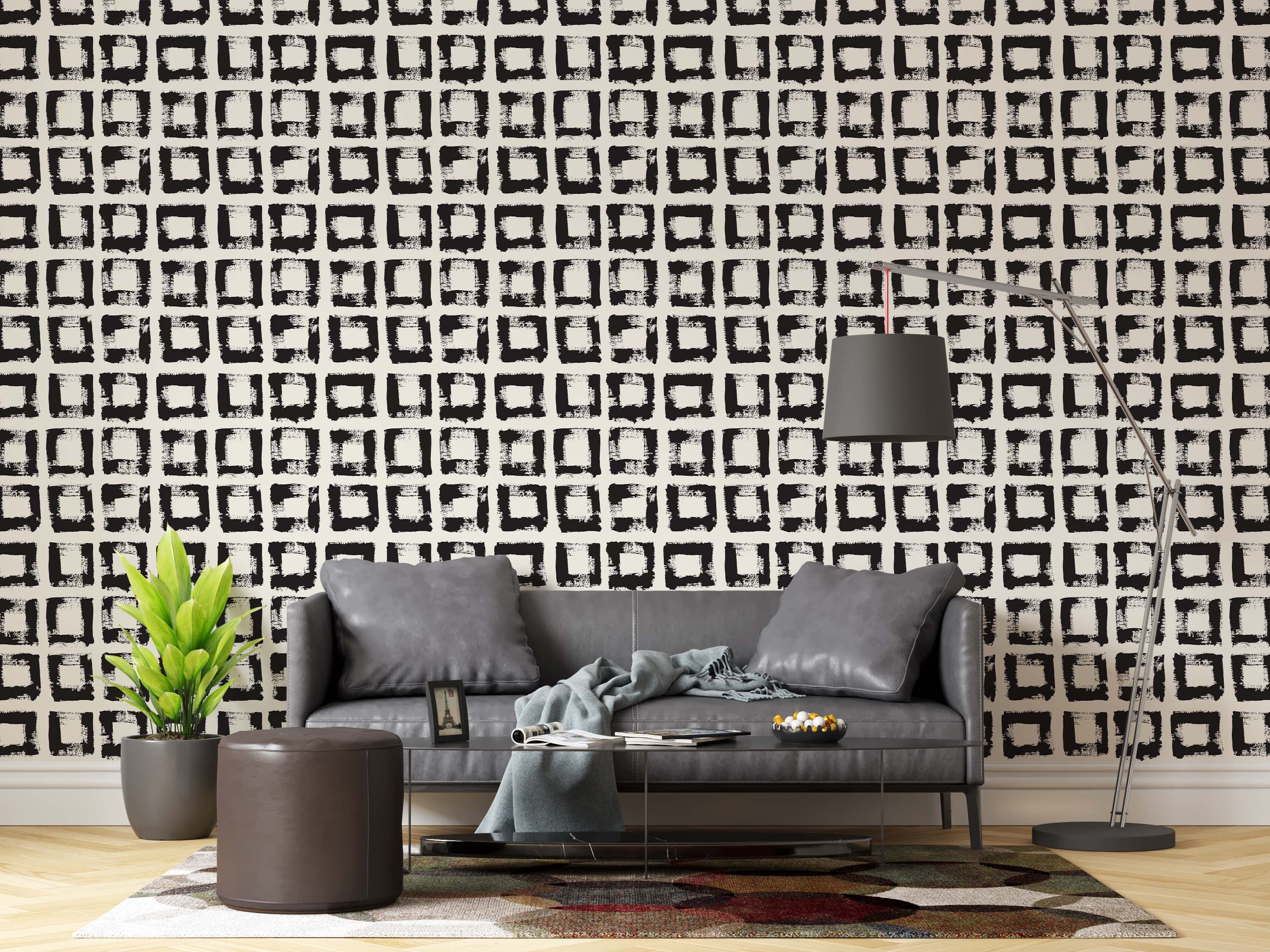 Wallpaper with a geometric grid pattern of rough, hand-painted black squares on an off-white background.