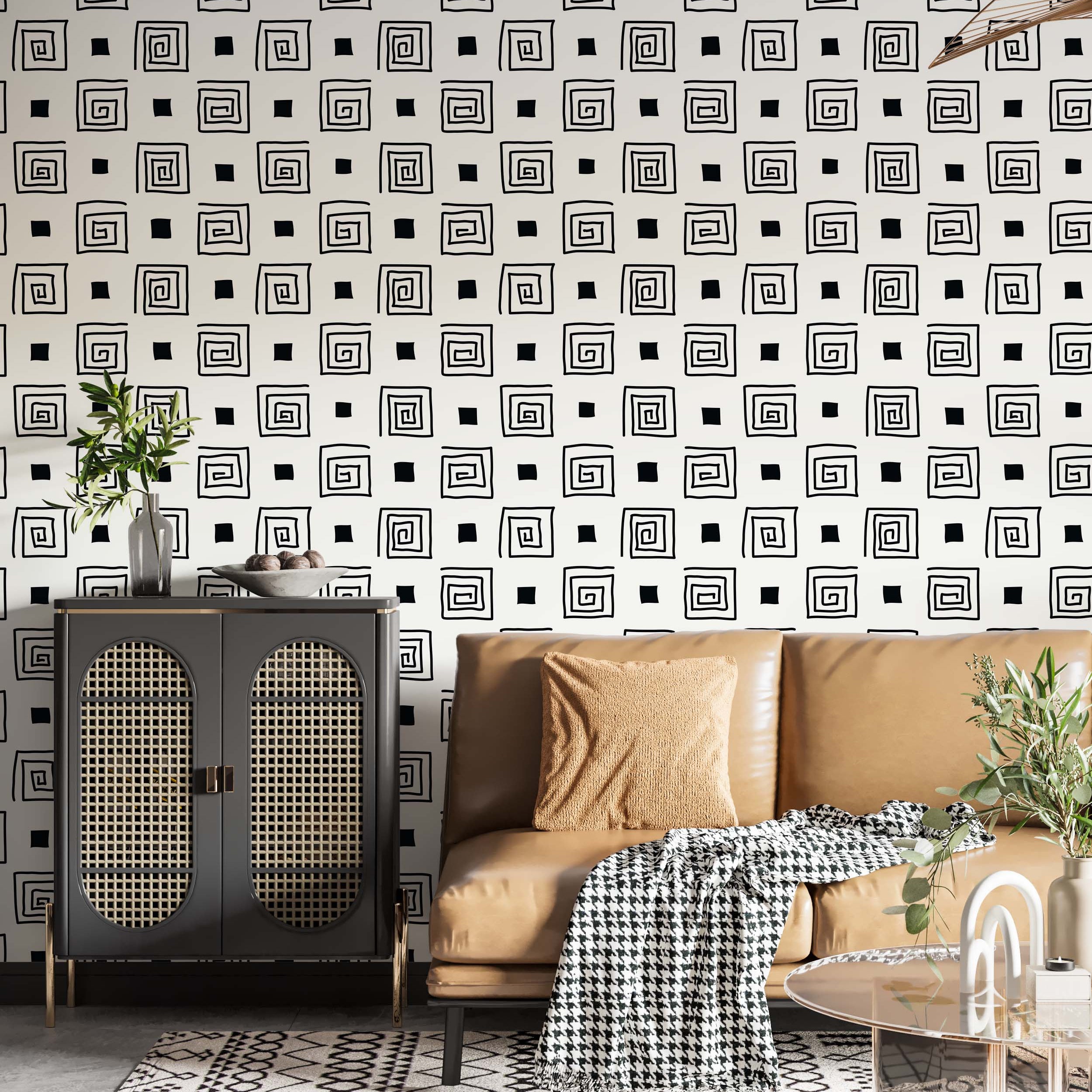 Wallpaper with a repeating pattern of hand-drawn black squares and spirals alternating on an off-white background.