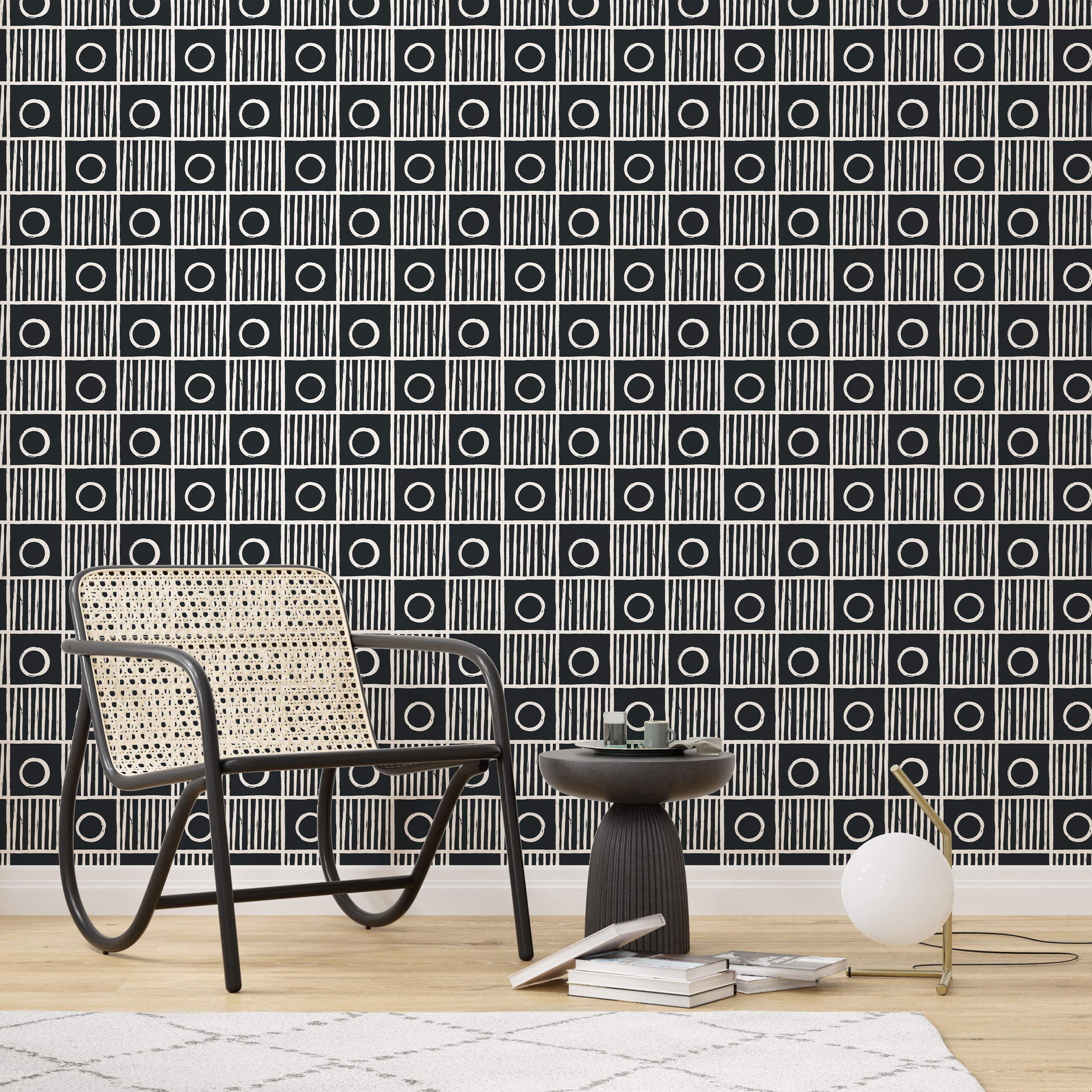 Wallpaper featuring a black and white geometric checkerboard pattern with alternating squares of circles and vertical stripes.