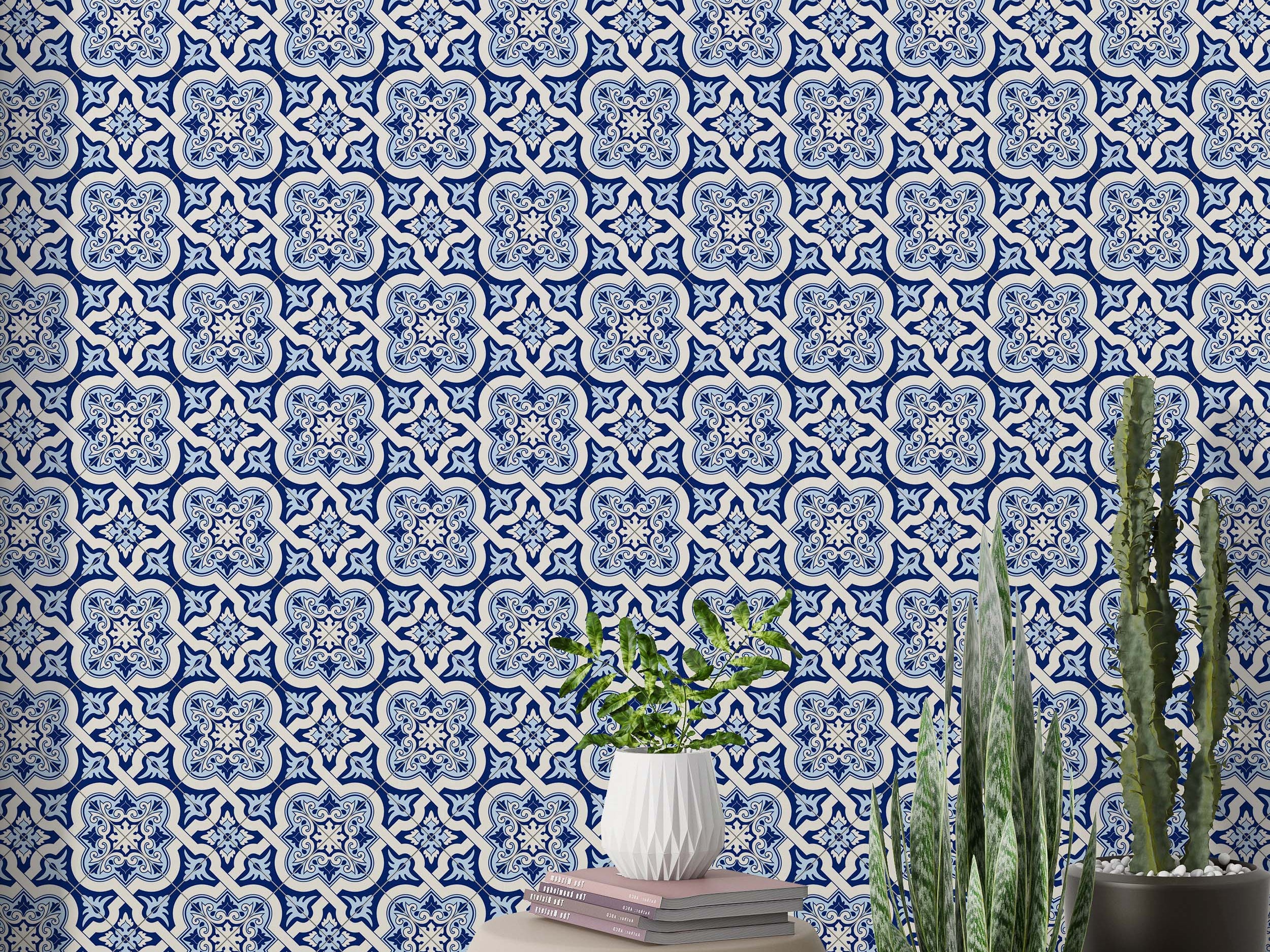 Geometric tile wallpaper with repeating blue and off-white quatrefoil motifs, detailed with intricate floral elements.