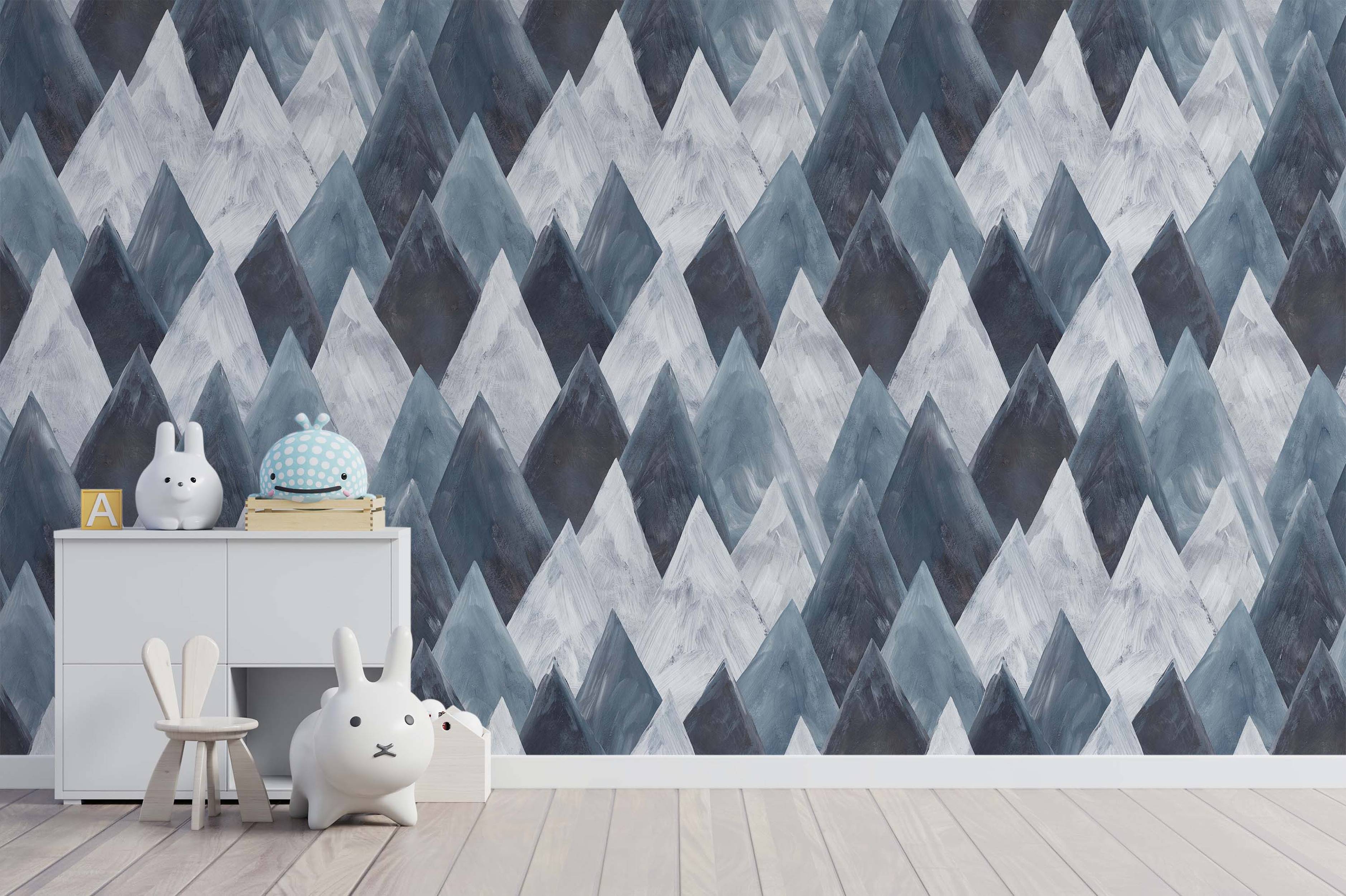 Wallpaper featuring overlapping geometric mountain peaks in blue-gray, gray, and white, with visible brushstroke textures.