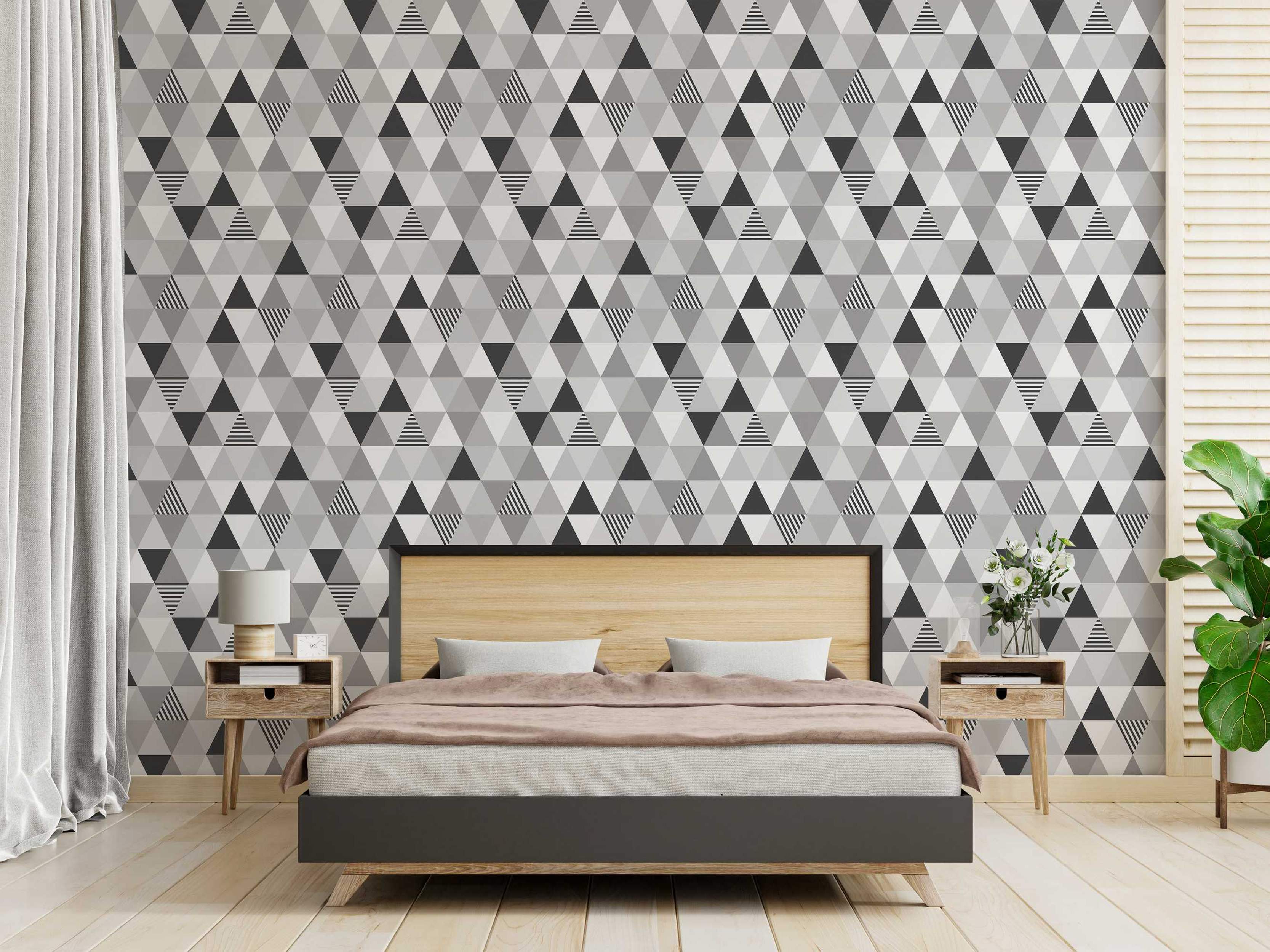Geometric wallpaper with a repeating pattern of triangles in shades of gray, dark gray, and black horizontal stripes.