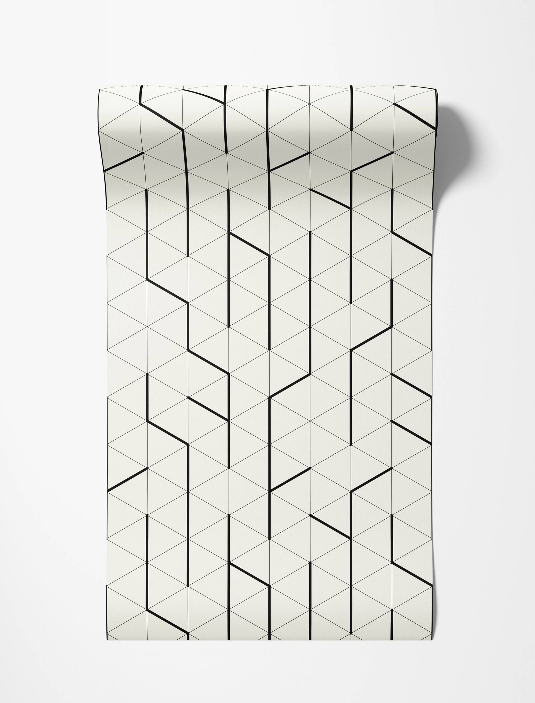 Geometric wallpaper featuring bold black lines forming angular shapes over a fine triangle grid on a cream background.