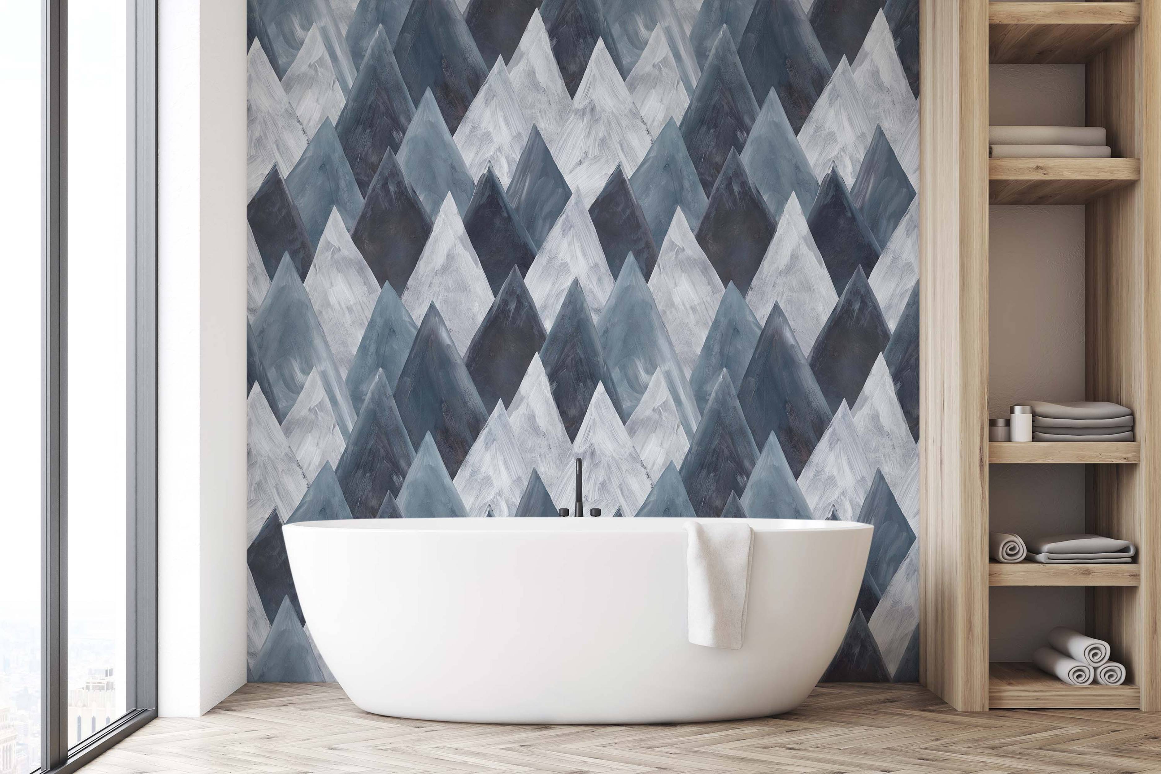 Geometric mountain peak wallpaper with a painted texture in shades of blue, gray, and white.