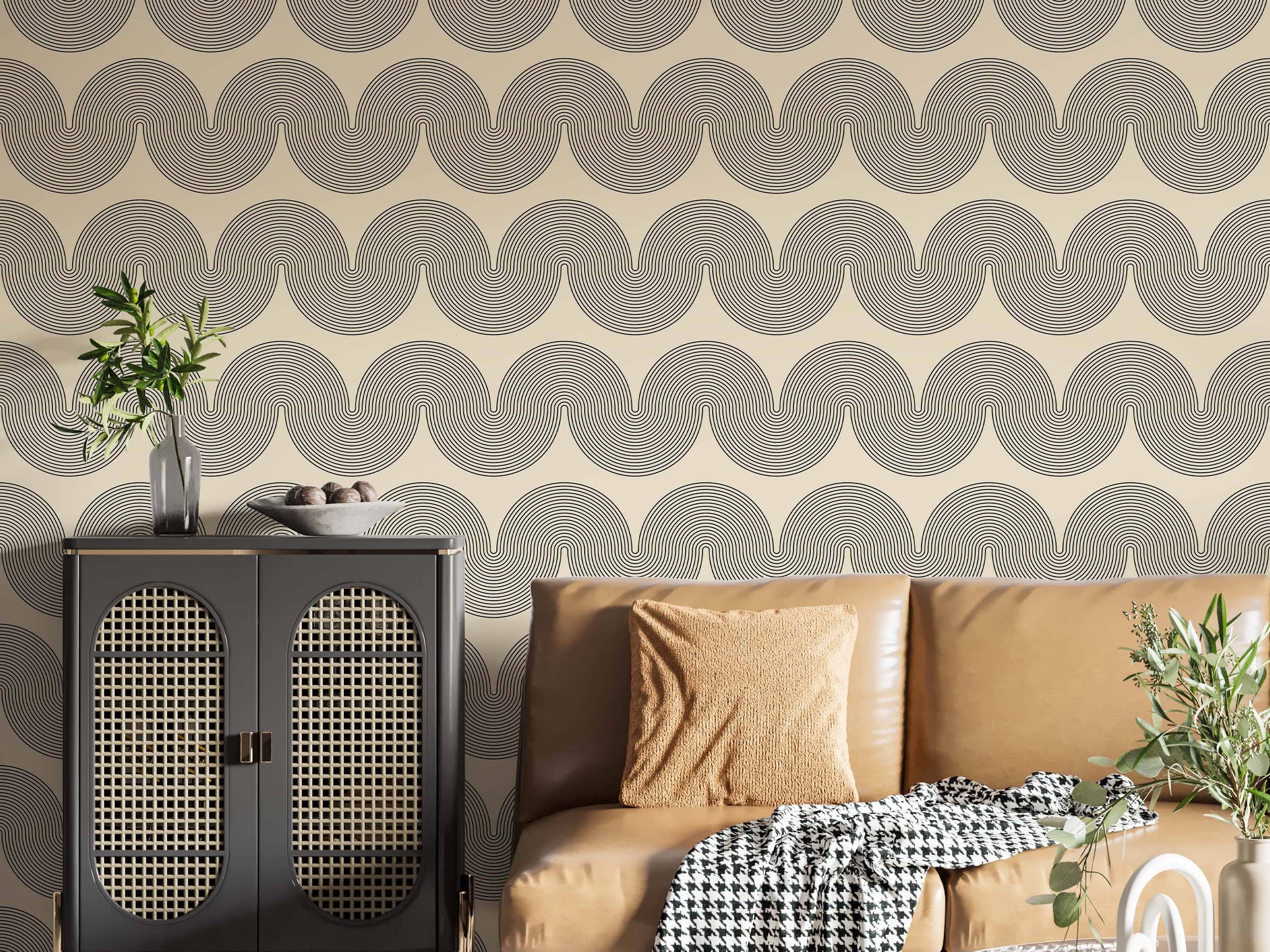 Wallpaper displaying a geometric wave pattern composed of fine black concentric lines against a pale beige field.
