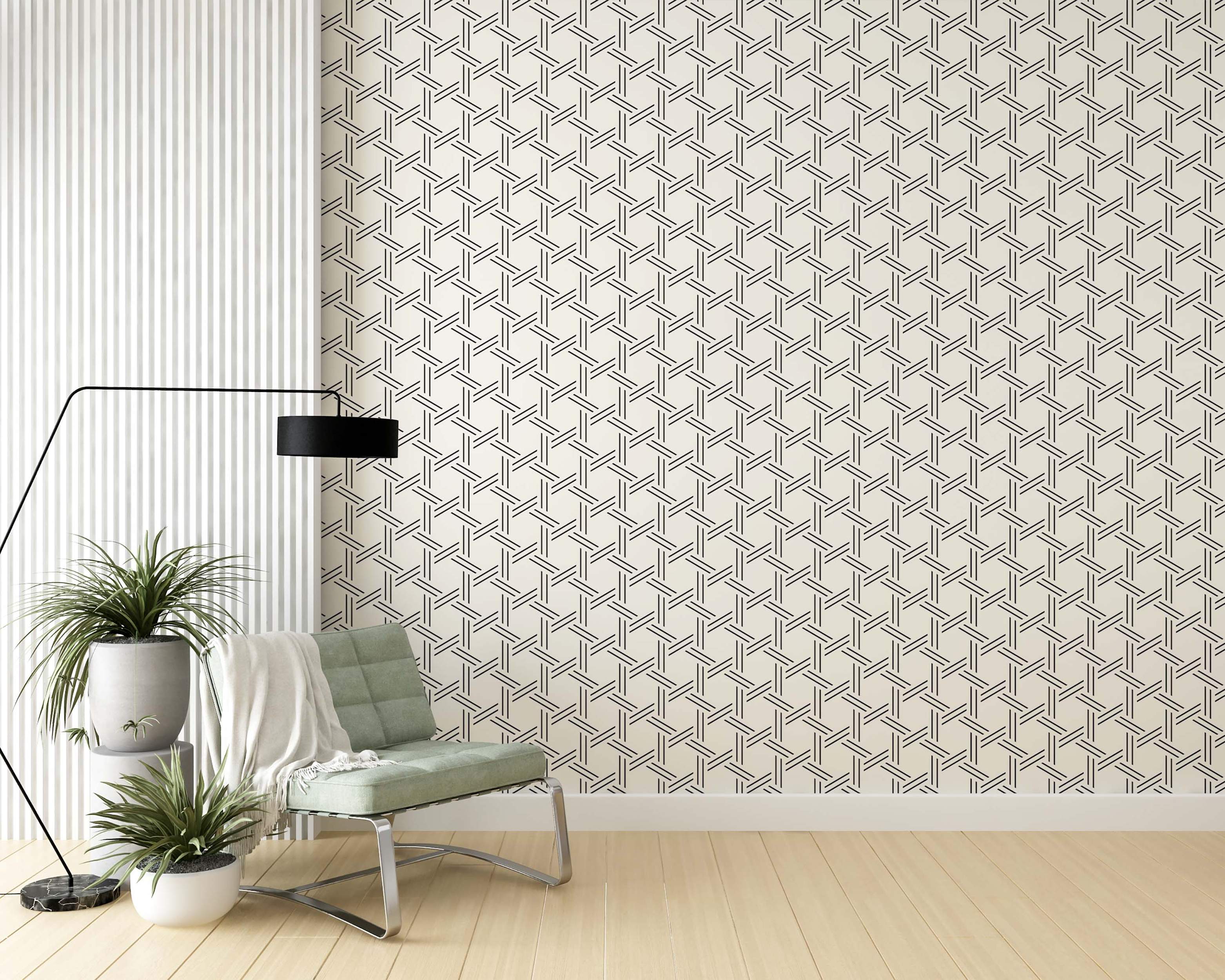 Wallpaper featuring a geometric weave pattern of interlocking black lines forming hexagons on a light beige background.