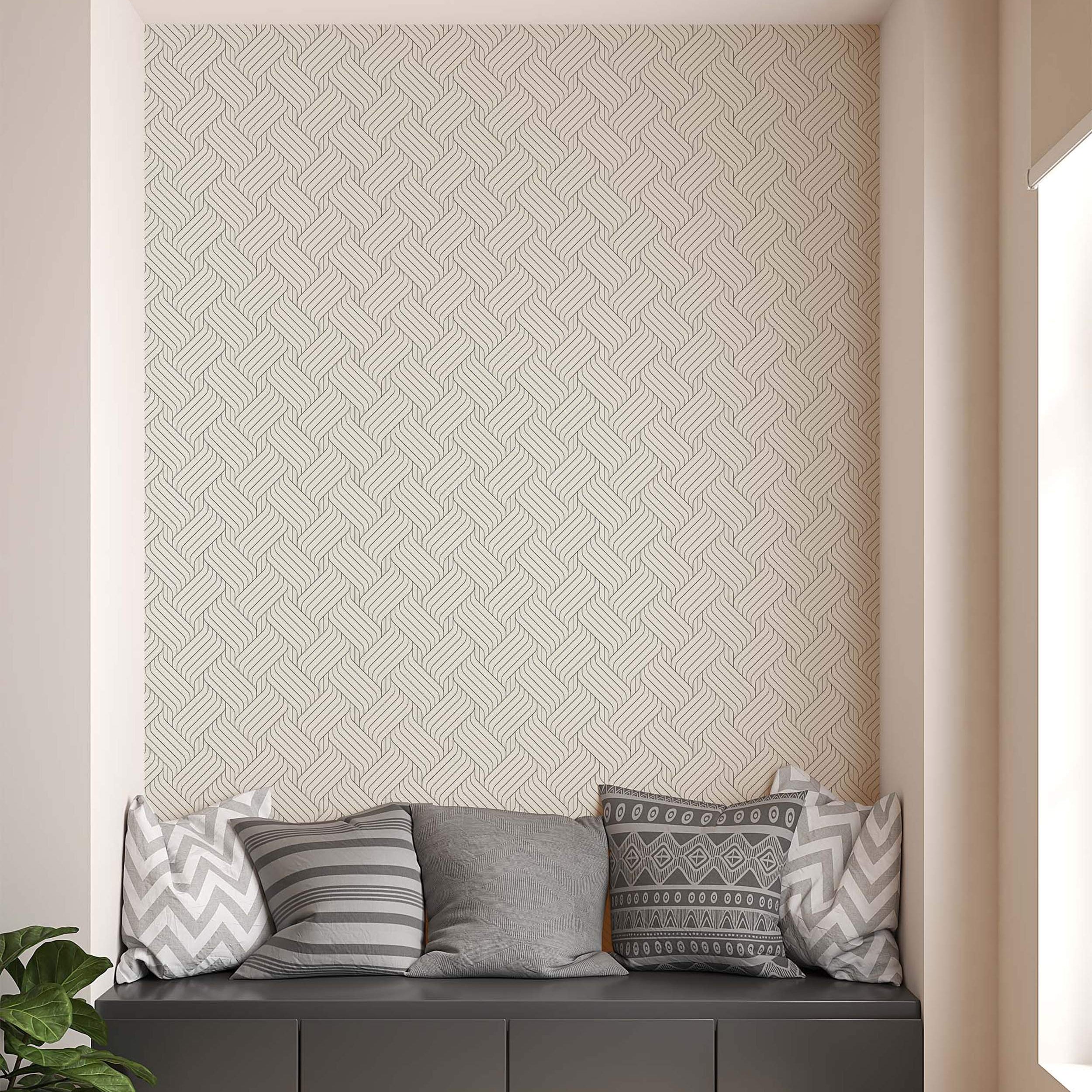 Geometric wallpaper featuring thin dark grey lines interlocking in a woven, braided pattern over a light beige background.
