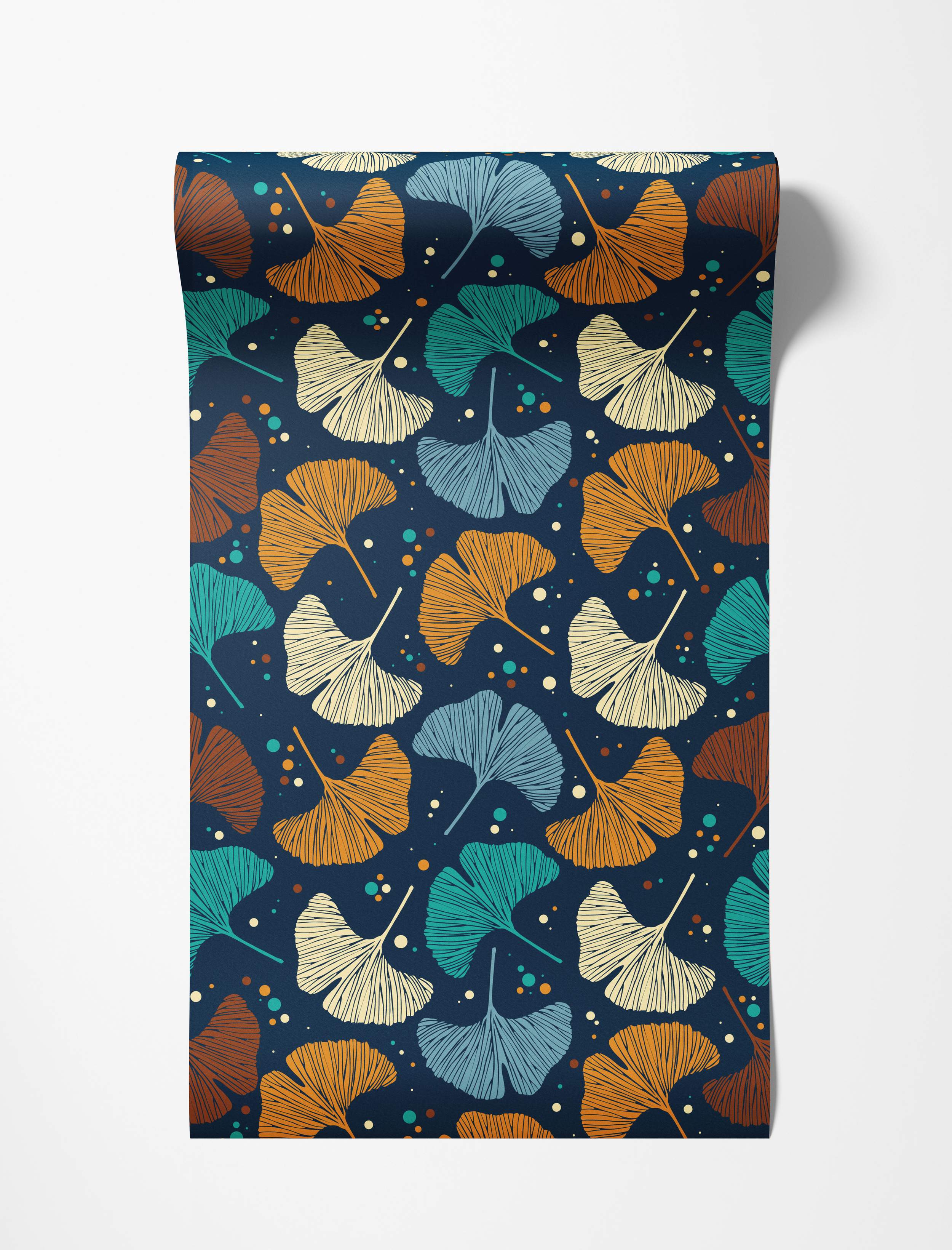 Wallpaper featuring stylized ginkgo leaves in teal, orange, brown, beige, and light blue scattered on a dark navy blue background.