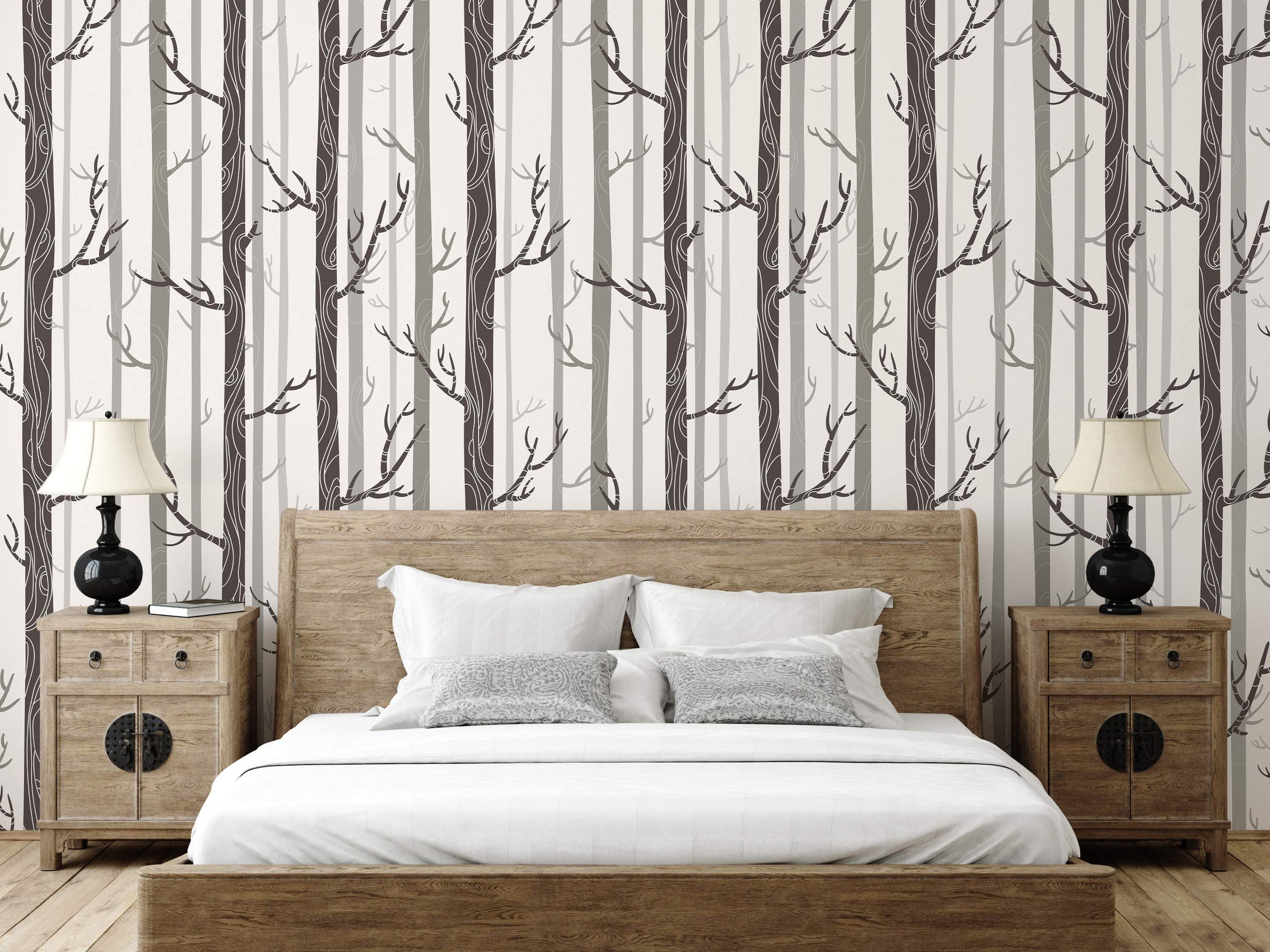 Stylized forest wallpaper with vertical dark and light grey tree trunks and white outlined branches on an off-white background.