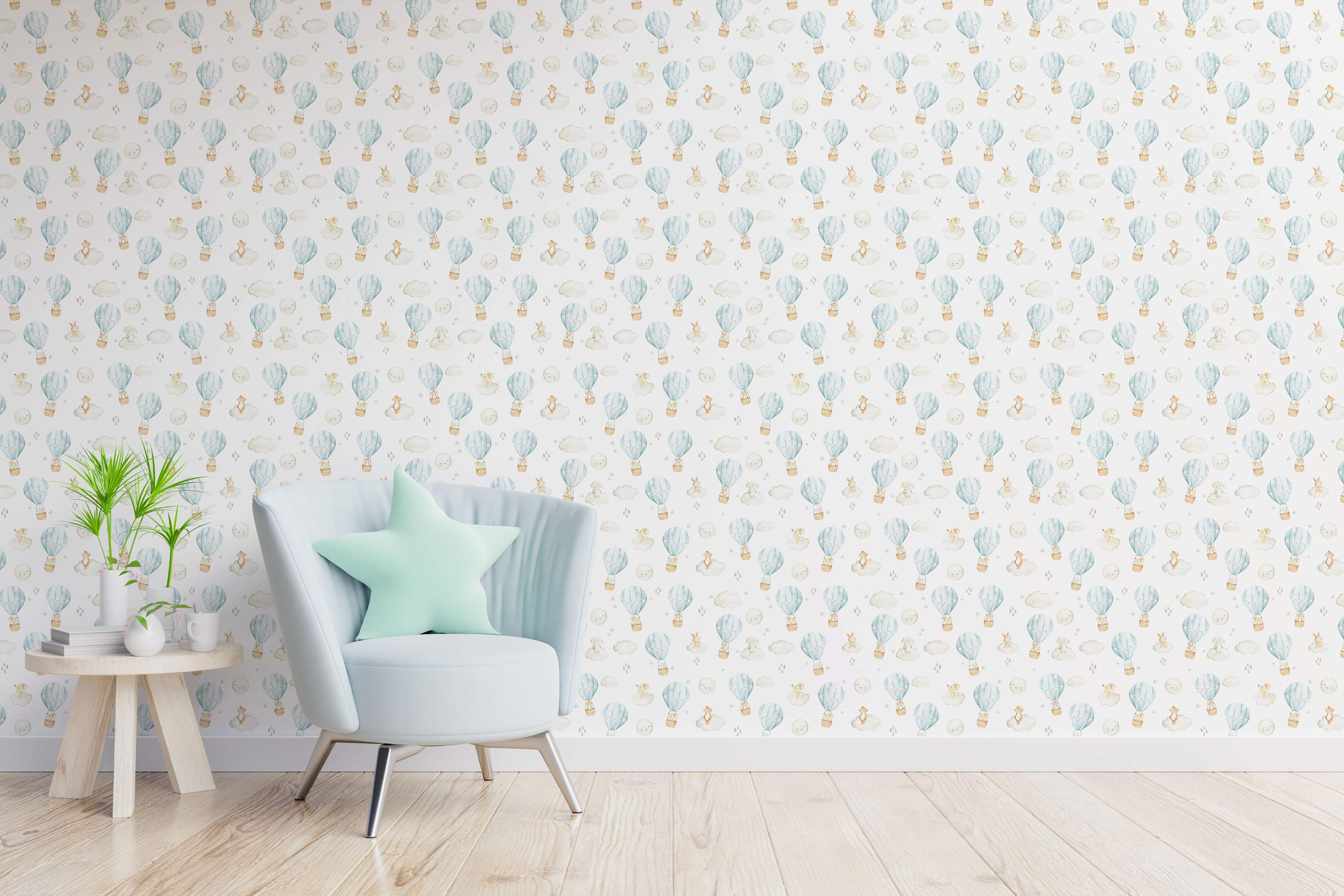 Watercolor wallpaper with a repeating pattern of light blue hot air balloons carrying animals, clouds, and moons on a white background.