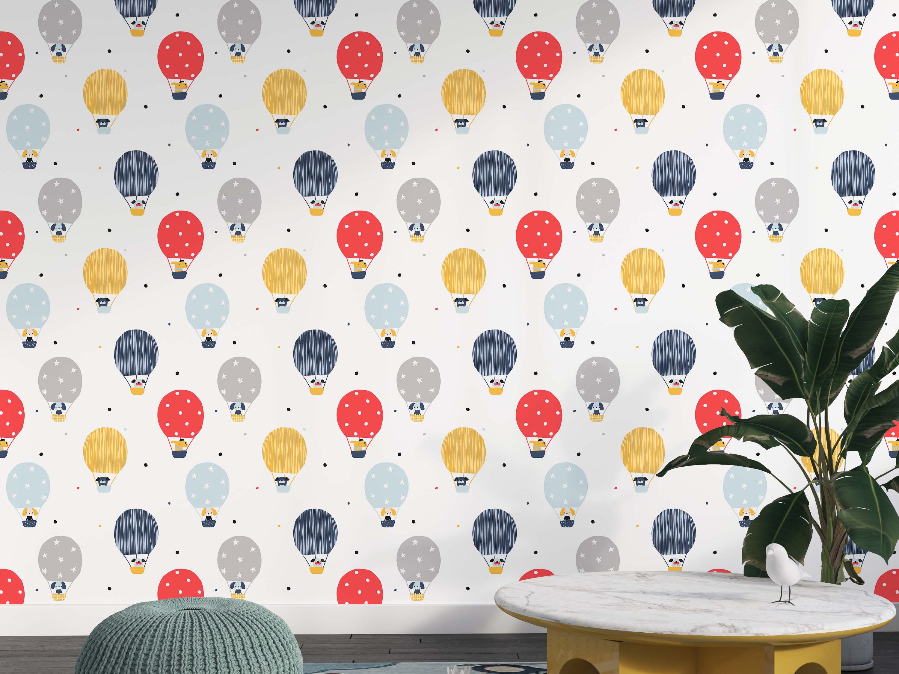 Wallpaper with a playful pattern of red, yellow, blue, and gray hot air balloons, each carrying a dog, on a white background with dots.