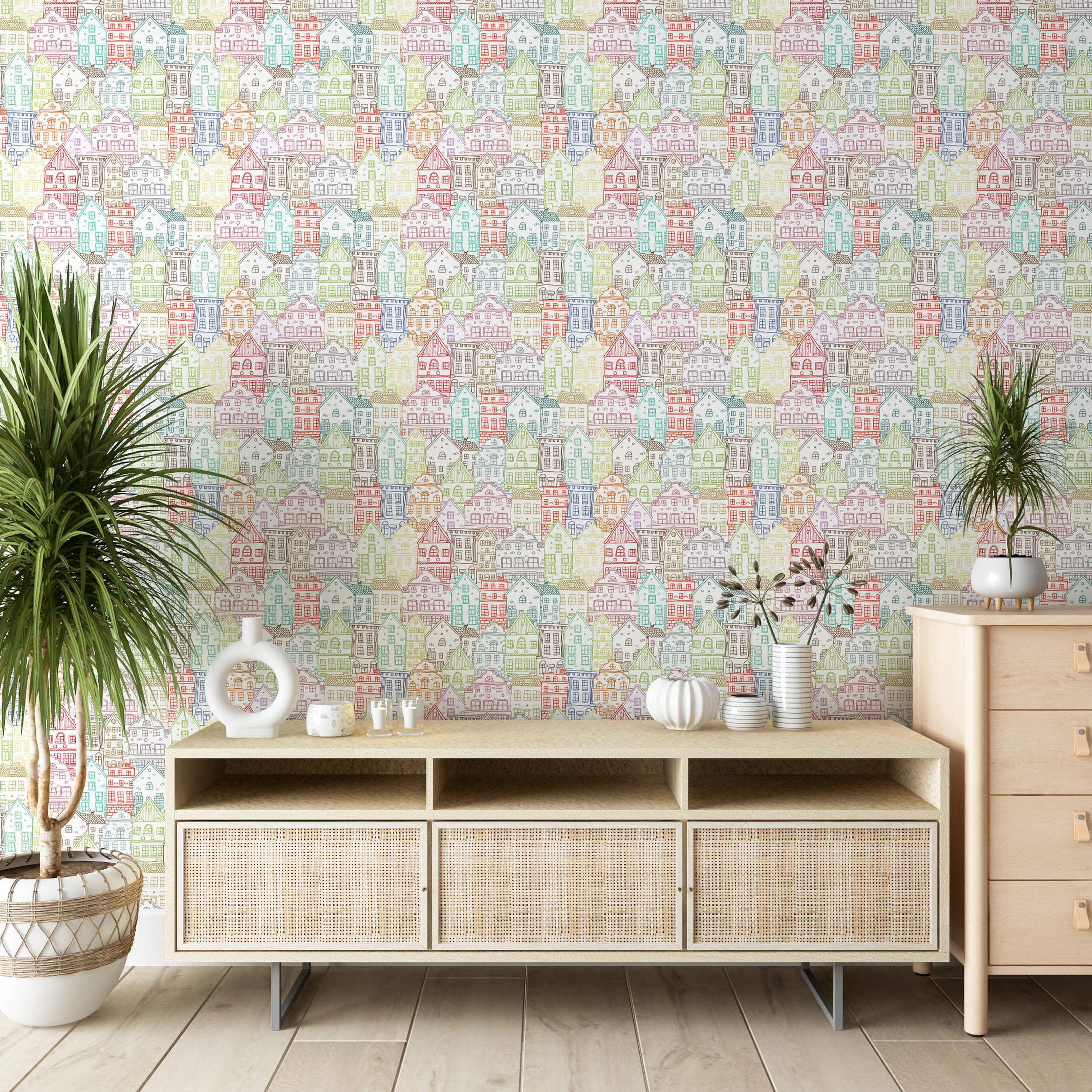 Wallpaper featuring a repeating pattern of hand-drawn illustrative houses in various pastel colors like blue, green, yellow, and pink.