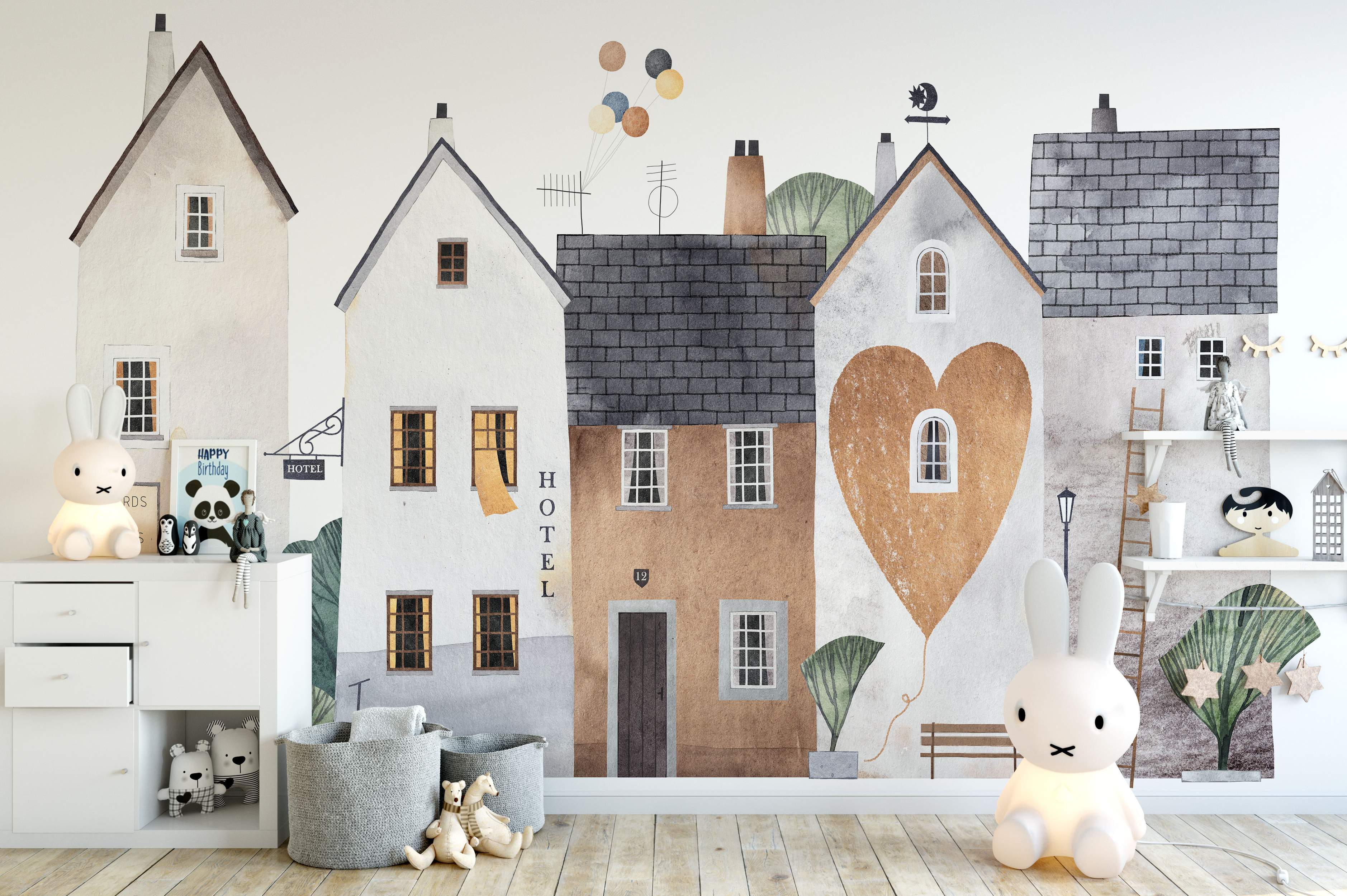 Whimsical watercolor mural depicting a street scene with houses in neutral beige, gray, and brown tones; one house features a large heart.