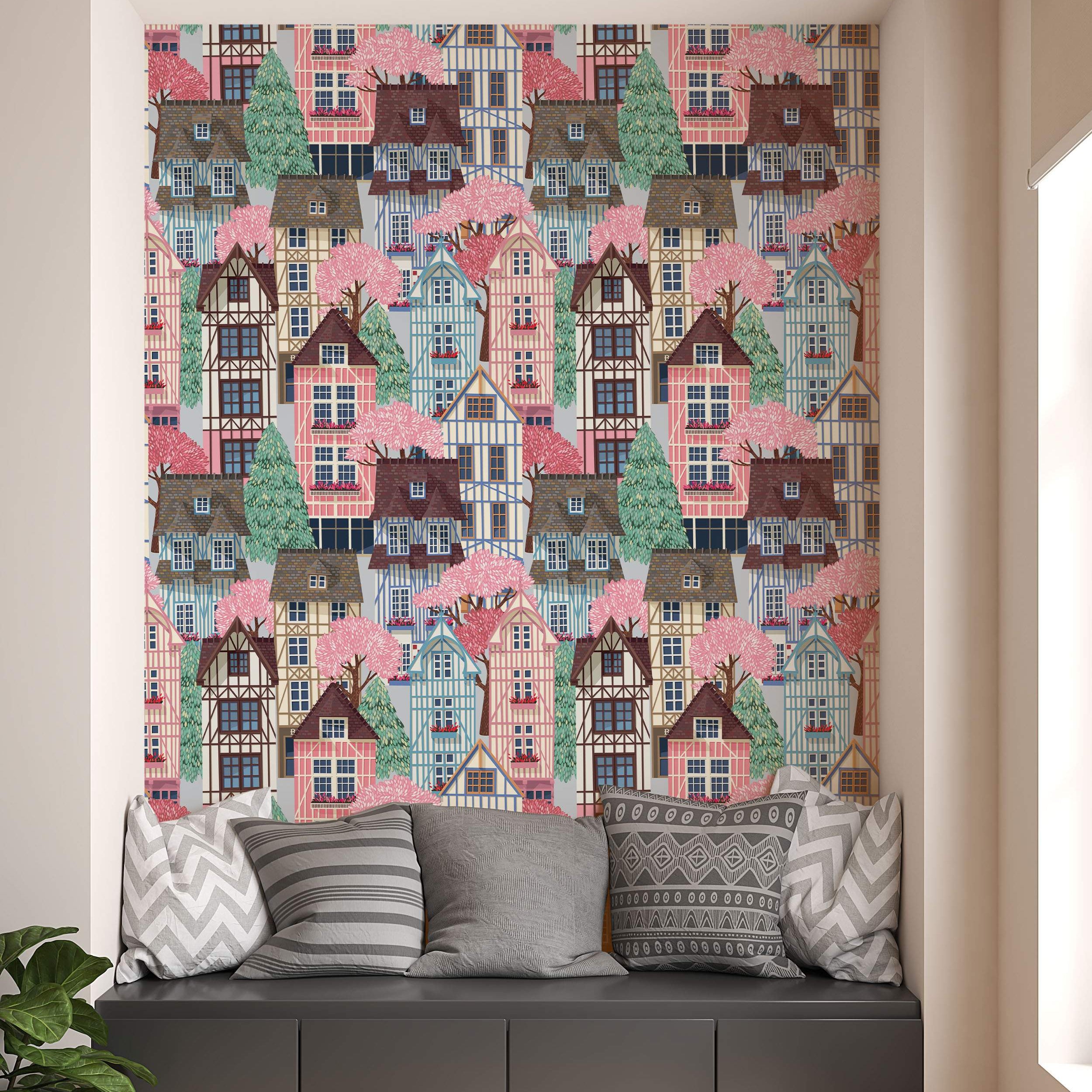 Illustrated wallpaper featuring a repeating pattern of colorful timbered houses and trees in pink, blue, green, and brown.
