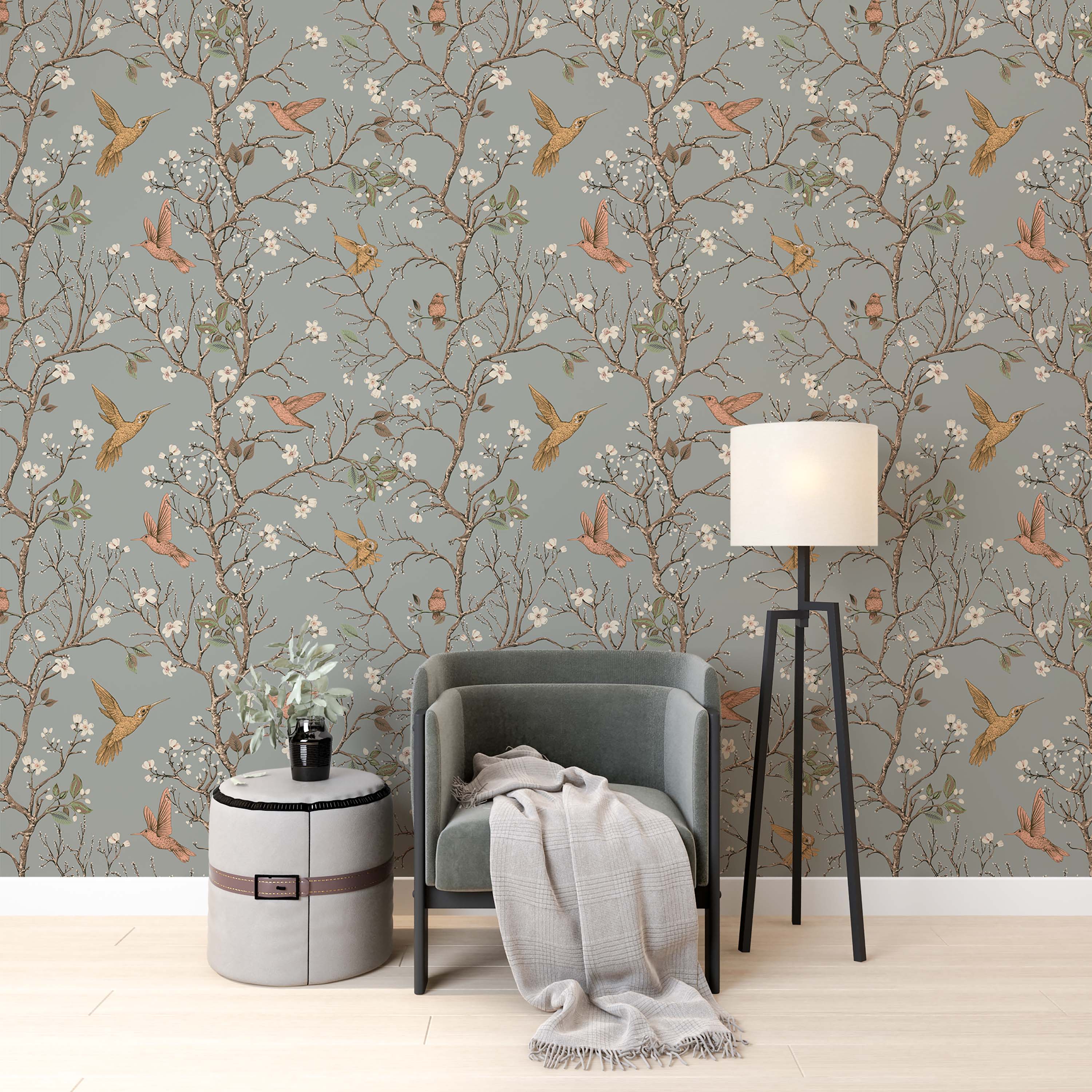 Illustrative wallpaper featuring golden and pink hummingbirds among flowering brown branches on a dusty blue-gray background.