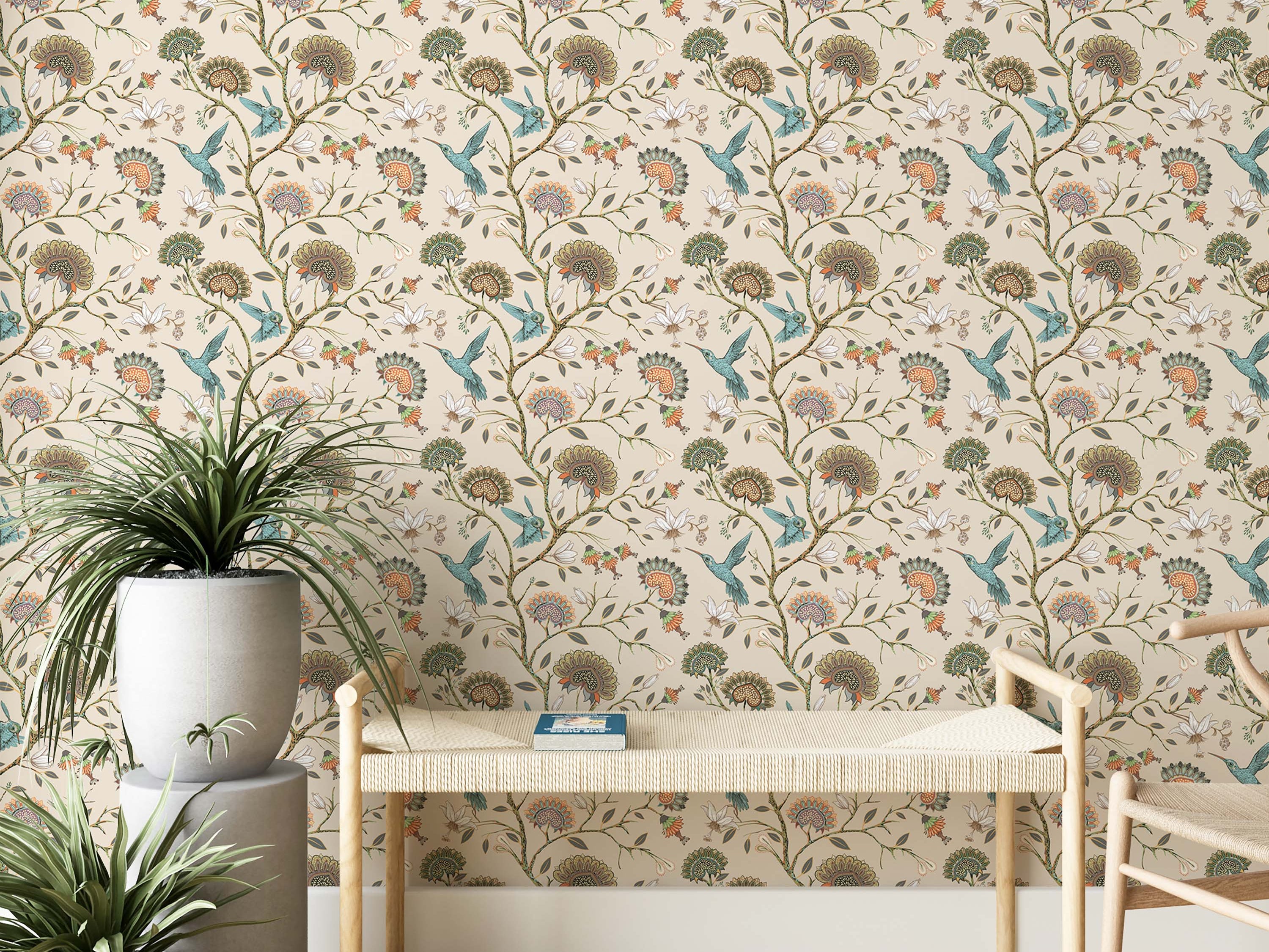 A repeating wallpaper pattern of teal hummingbirds and stylized floral vines in orange, green, and brown on a cream background.