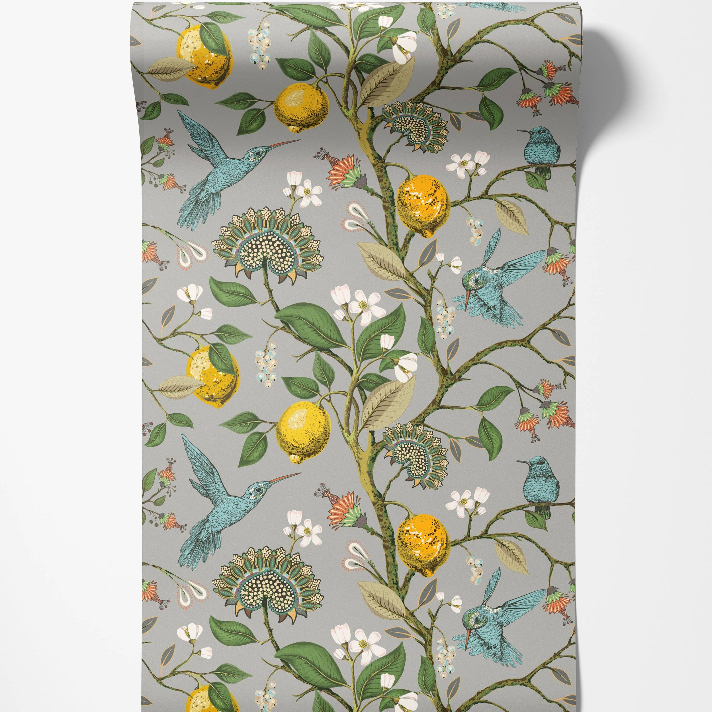 A botanical wallpaper with blue hummingbirds, yellow lemons, and stylized flowers on a gray background.