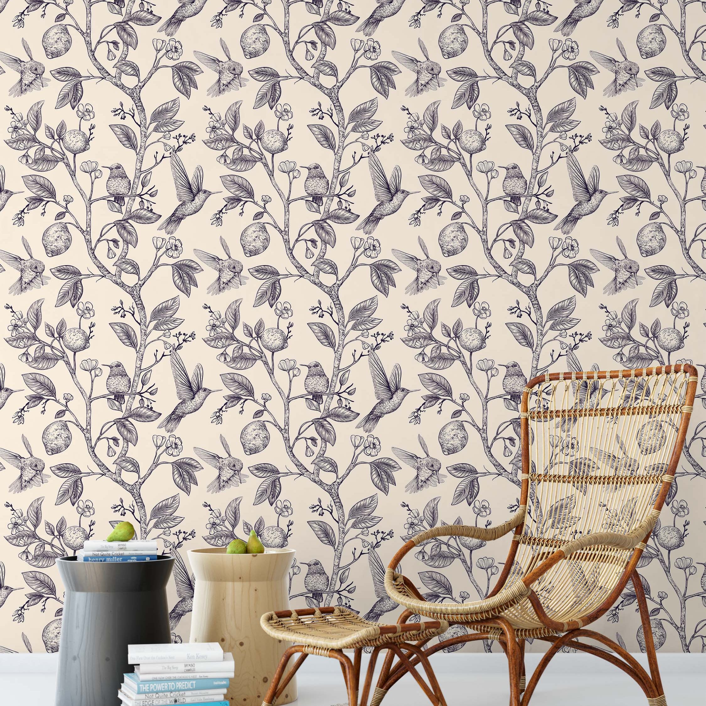 A vintage-style wallpaper featuring an intricate line drawing of hummingbirds, lemon trees, and blossoms in black on a cream field.