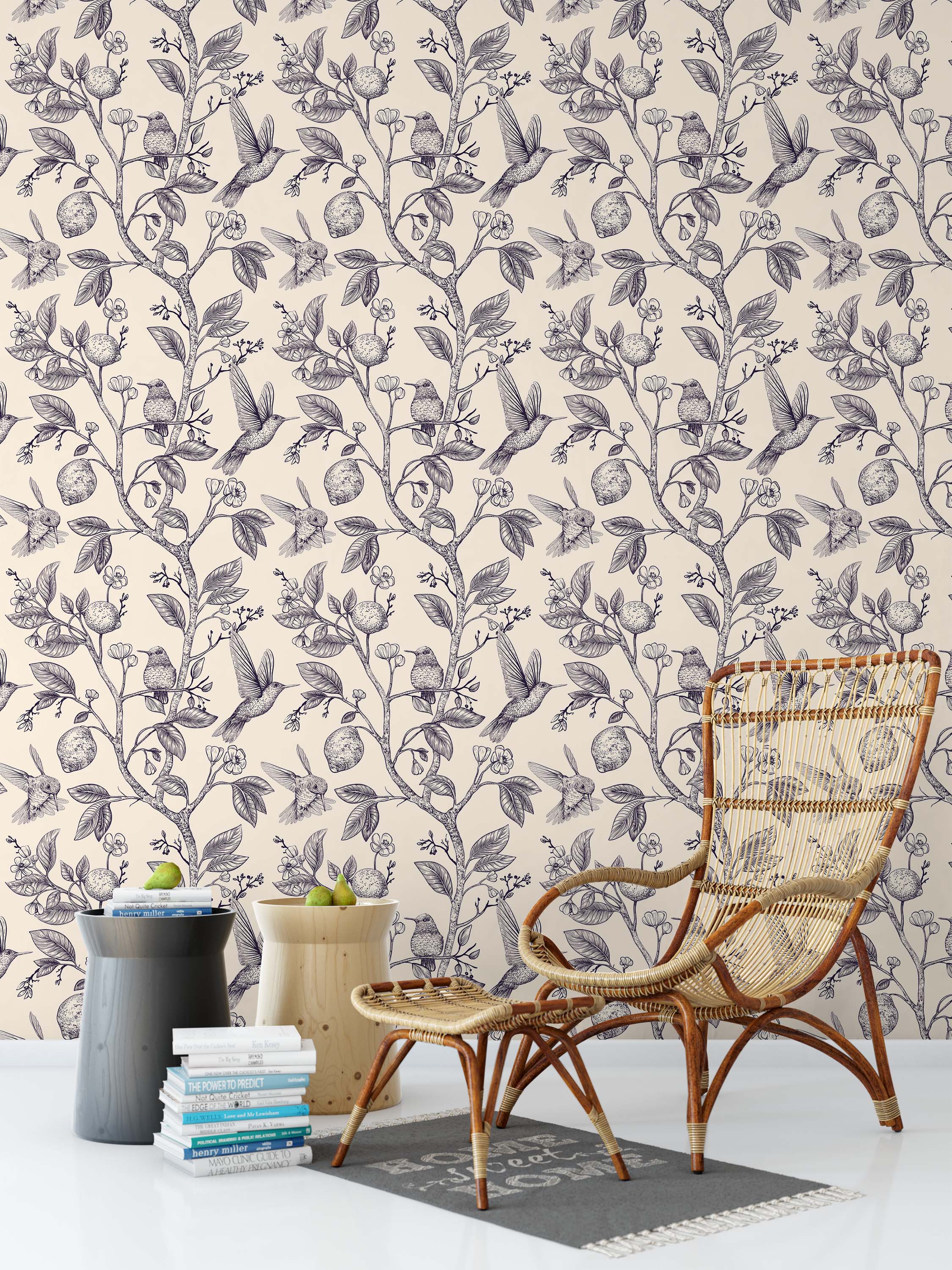A vintage-style wallpaper featuring an intricate line drawing of hummingbirds, lemon trees, and blossoms in black on a cream field.