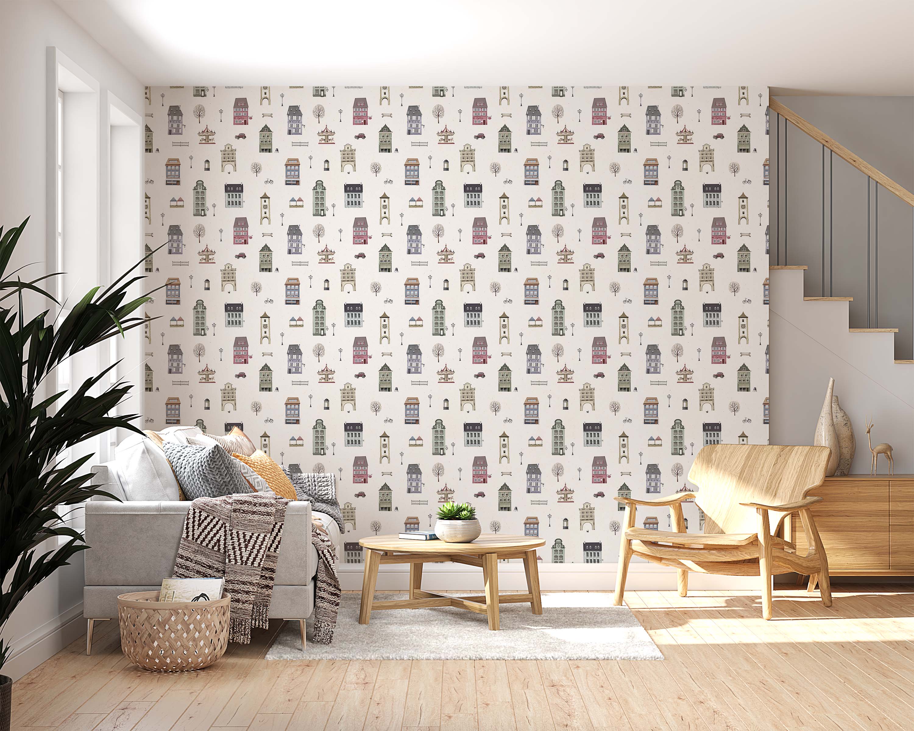 Wallpaper with a repeating design of illustrated pastel town buildings, trees, and cars on a light neutral background.