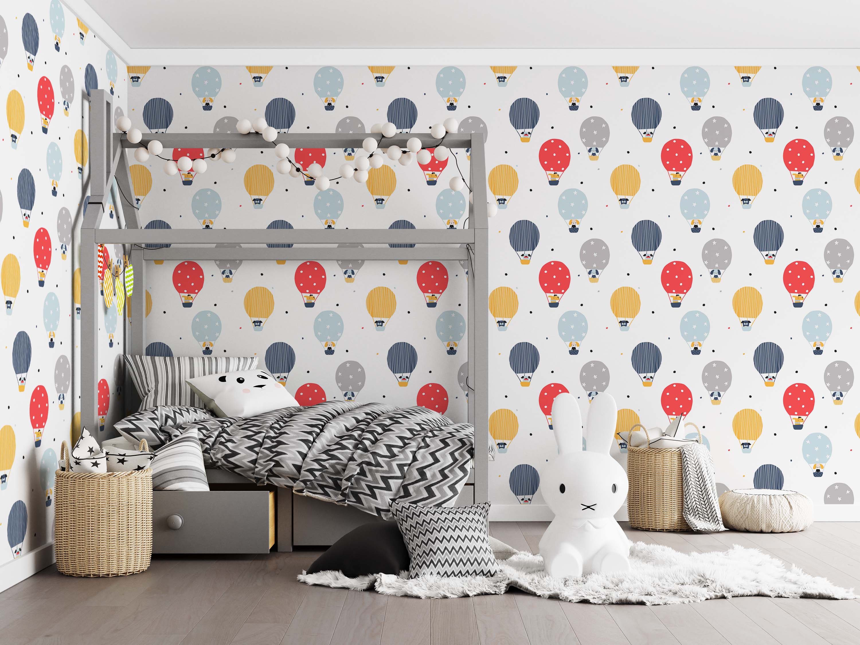 Repeating wallpaper with red, yellow, blue, and gray hot air balloons carrying animals, on a white background with scattered dots.