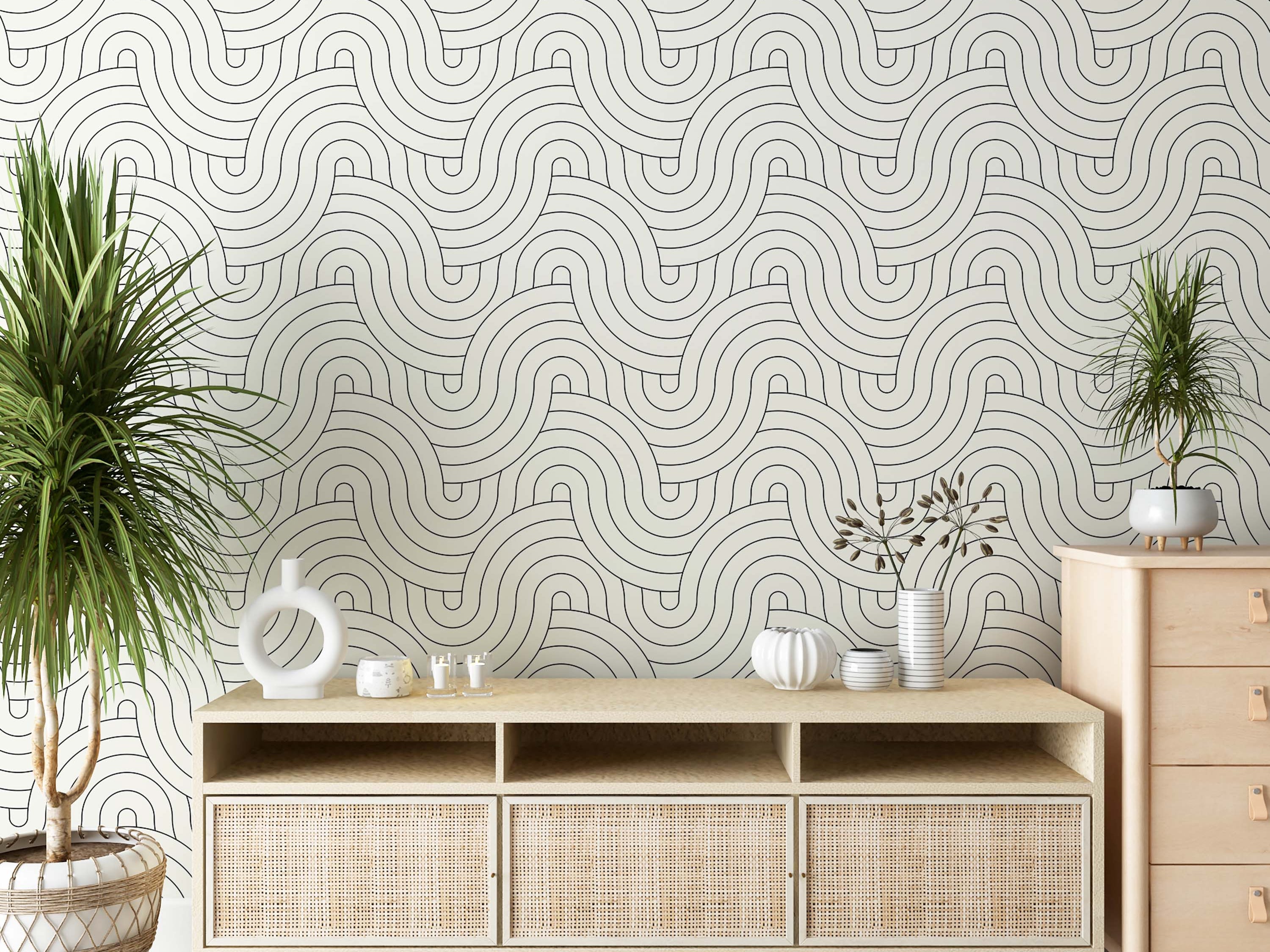 Abstract wallpaper with thin black lines forming interlocking, repeating wavy arches on a pale background.